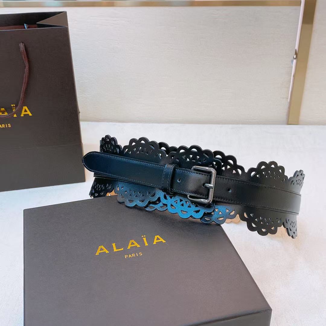Alaïa black leather laser-cut waist belt.