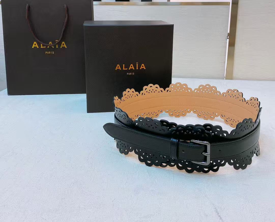 Alaïa black leather laser-cut waist belt.