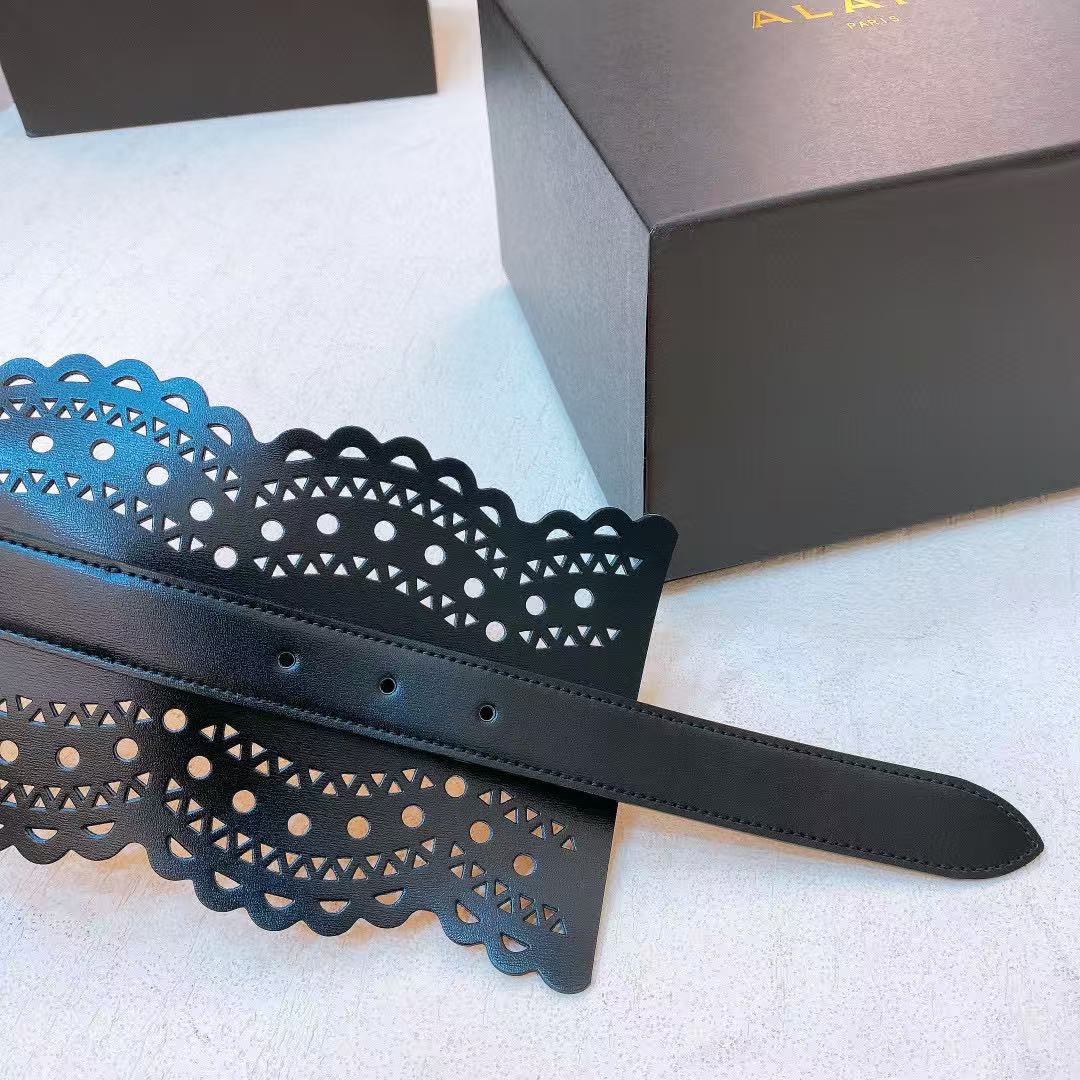 Alaïa black leather laser-cut waist belt.