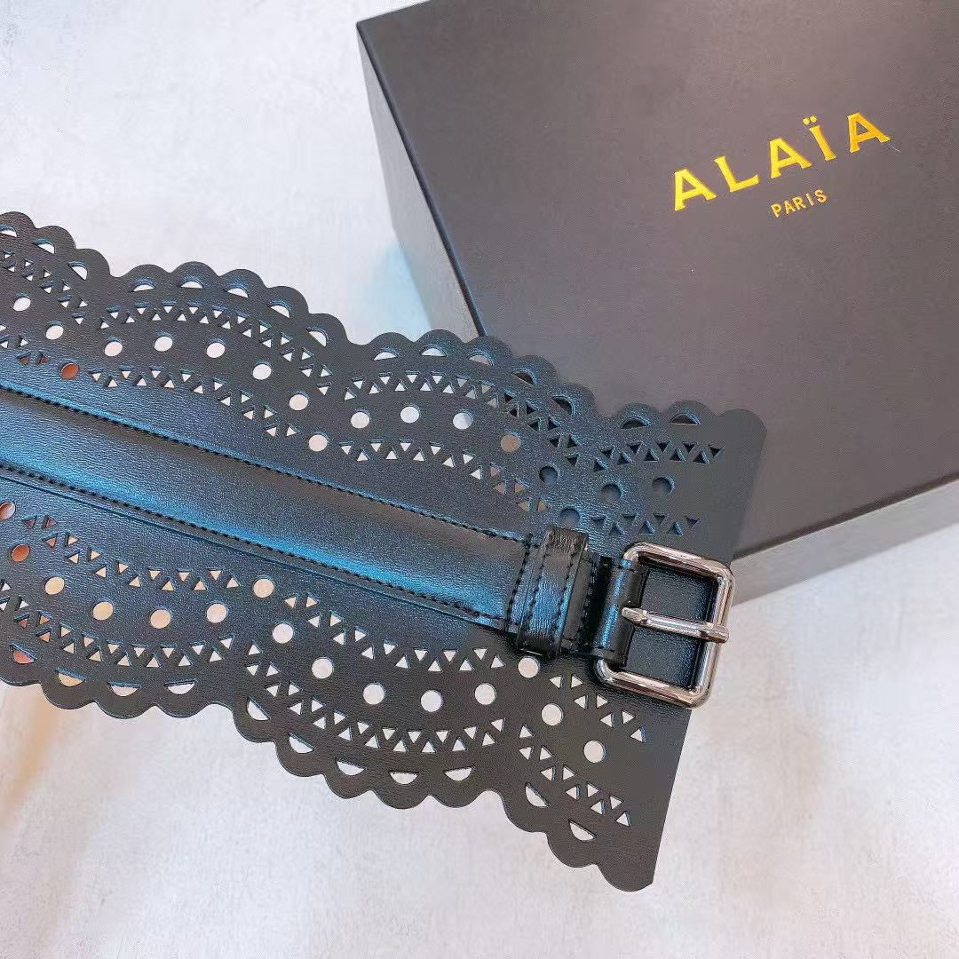 Alaïa black leather laser-cut waist belt.