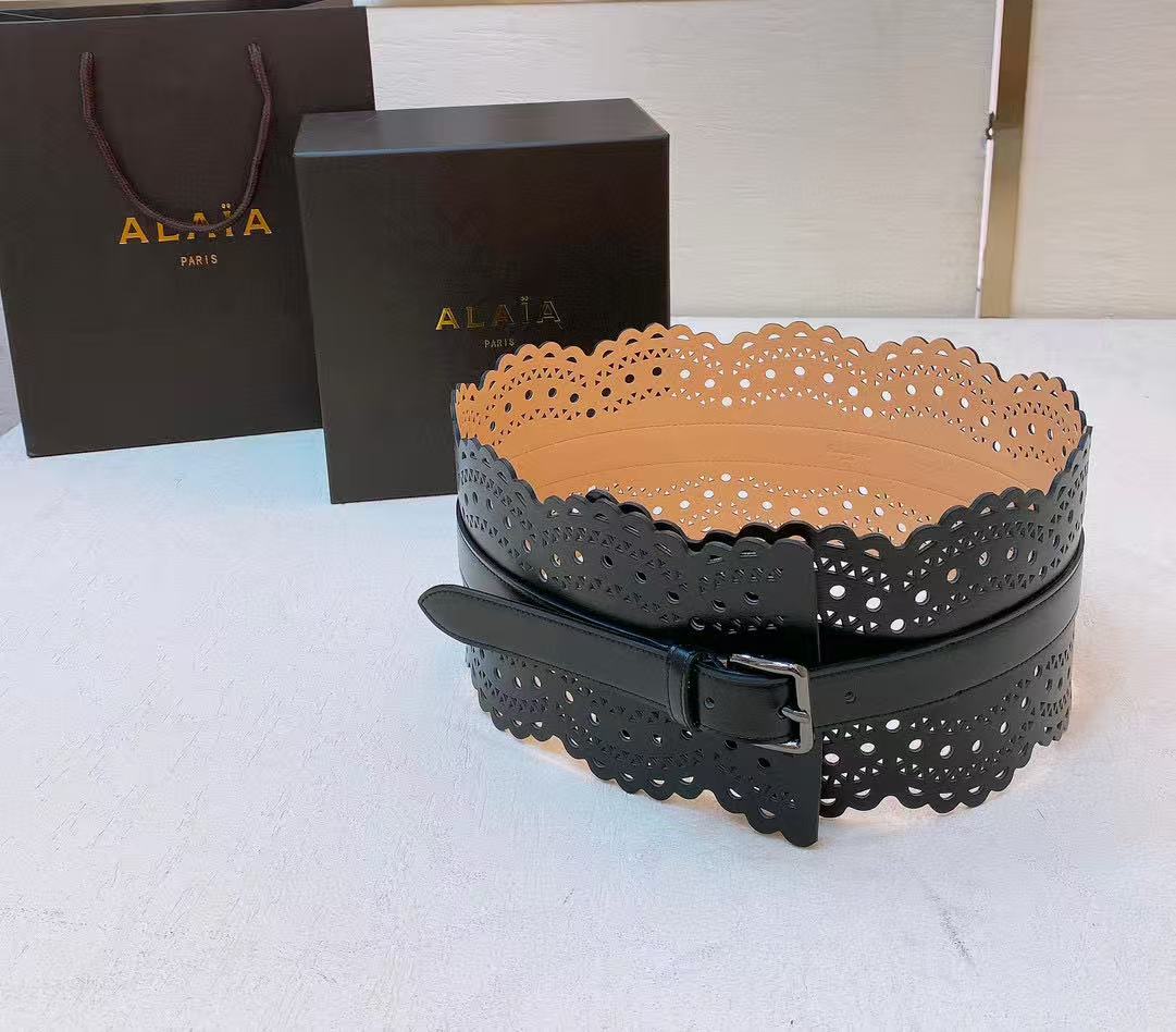 Alaïa black leather laser-cut waist belt.