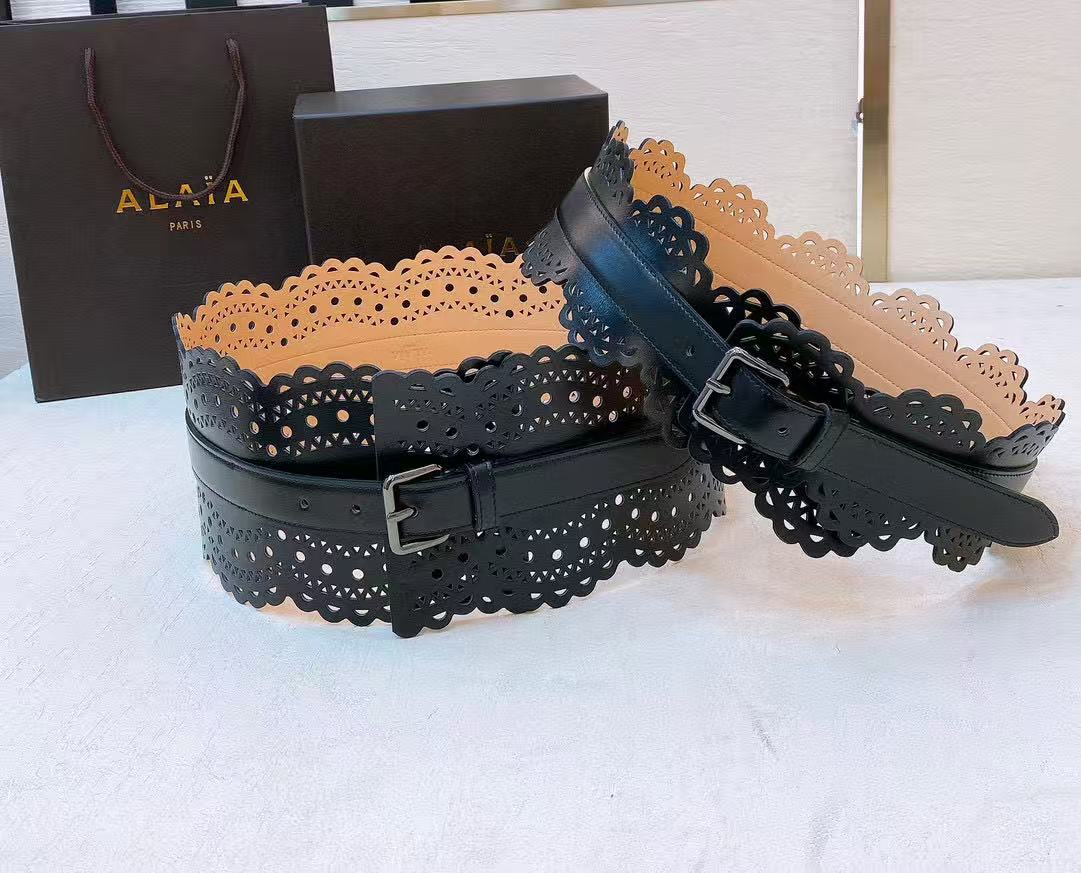Alaïa black leather laser-cut waist belt.