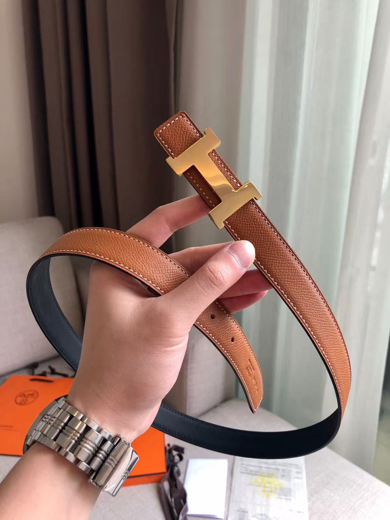 Hermès Focus H buckle and reversible leather strap belt 2.4mm in black and tawny brown leather with a rose gold-plated