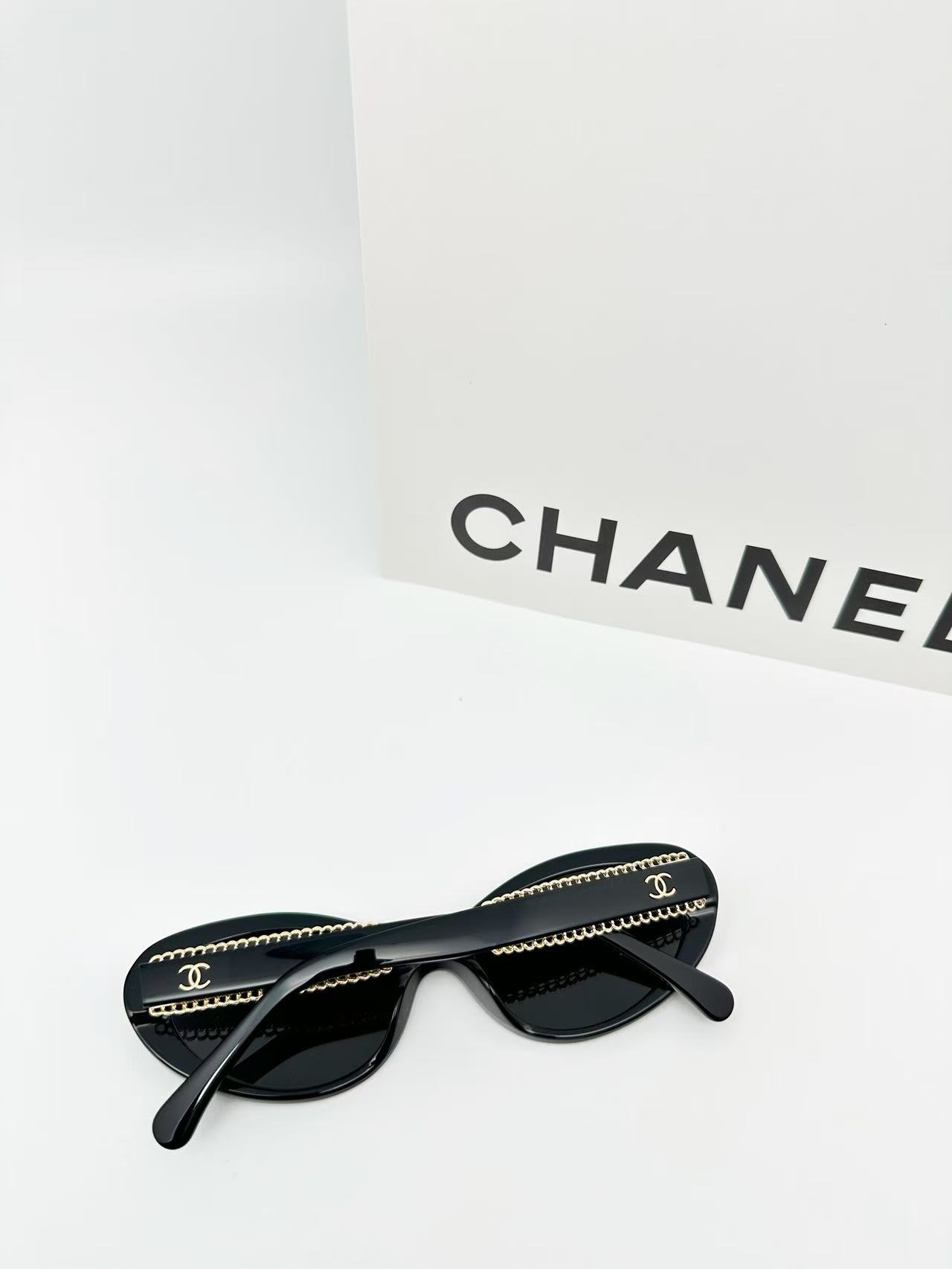 Chanel CH5515 oval sunglasses in black acetate with black lenses.