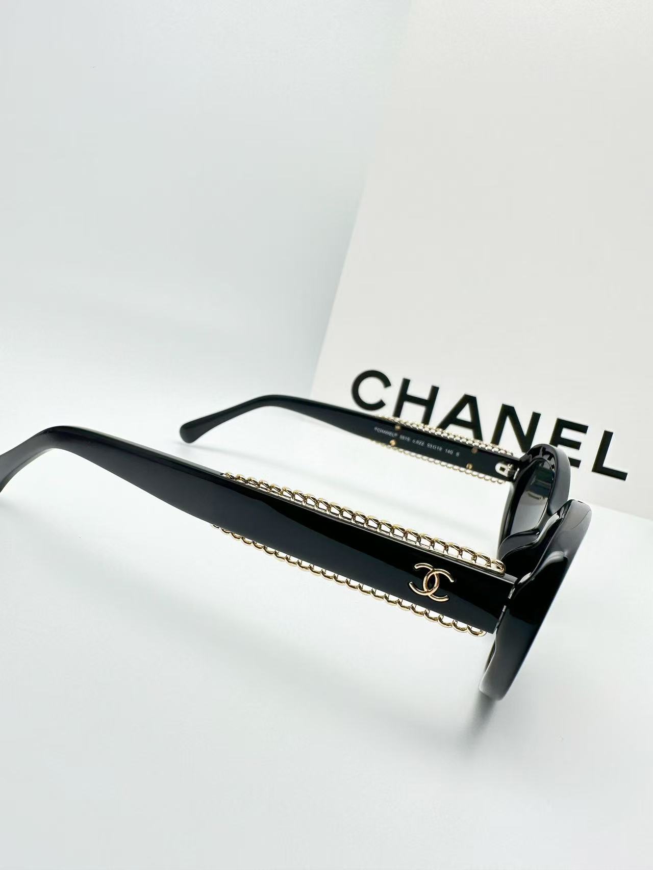 Chanel CH5515 oval sunglasses in black acetate with black lenses.
