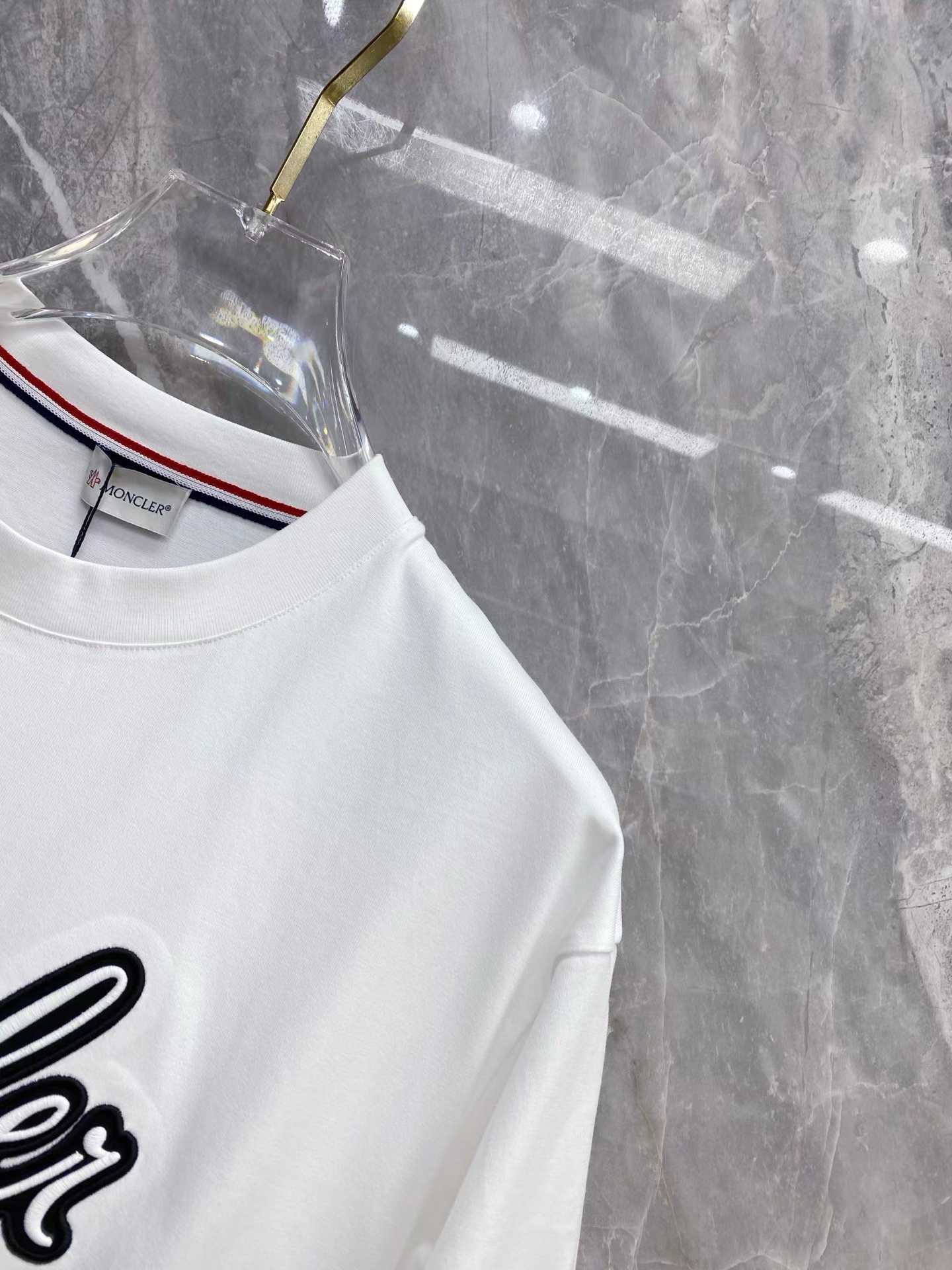 Moncler Embroidered Varsity Logo Cotton T-shirt in white and black colorways