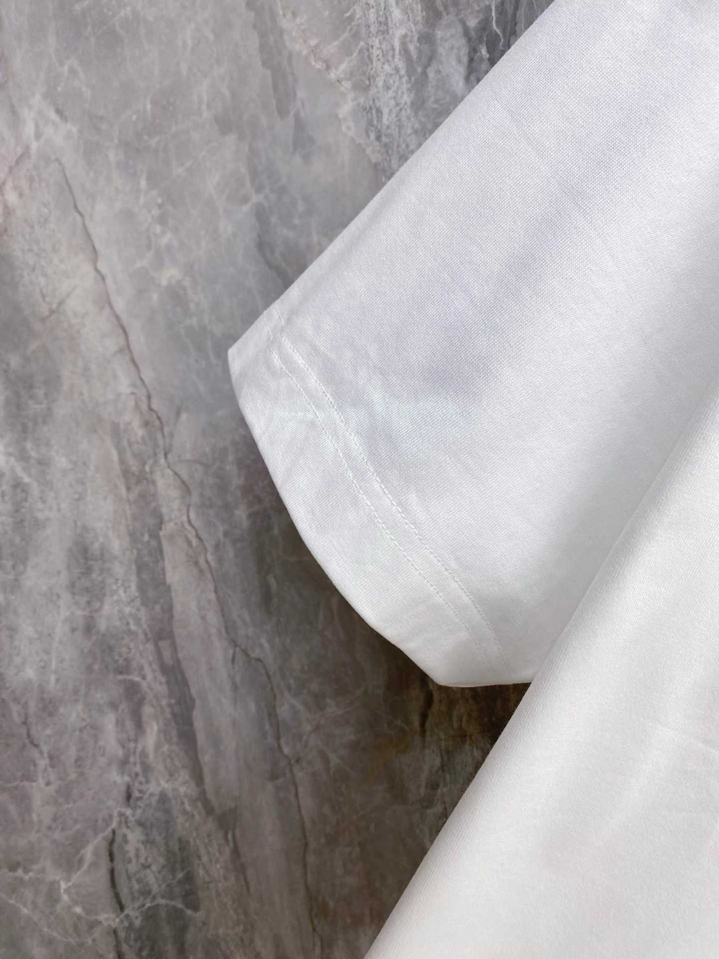 Moncler Embroidered Varsity Logo Cotton T-shirt in white and black colorways