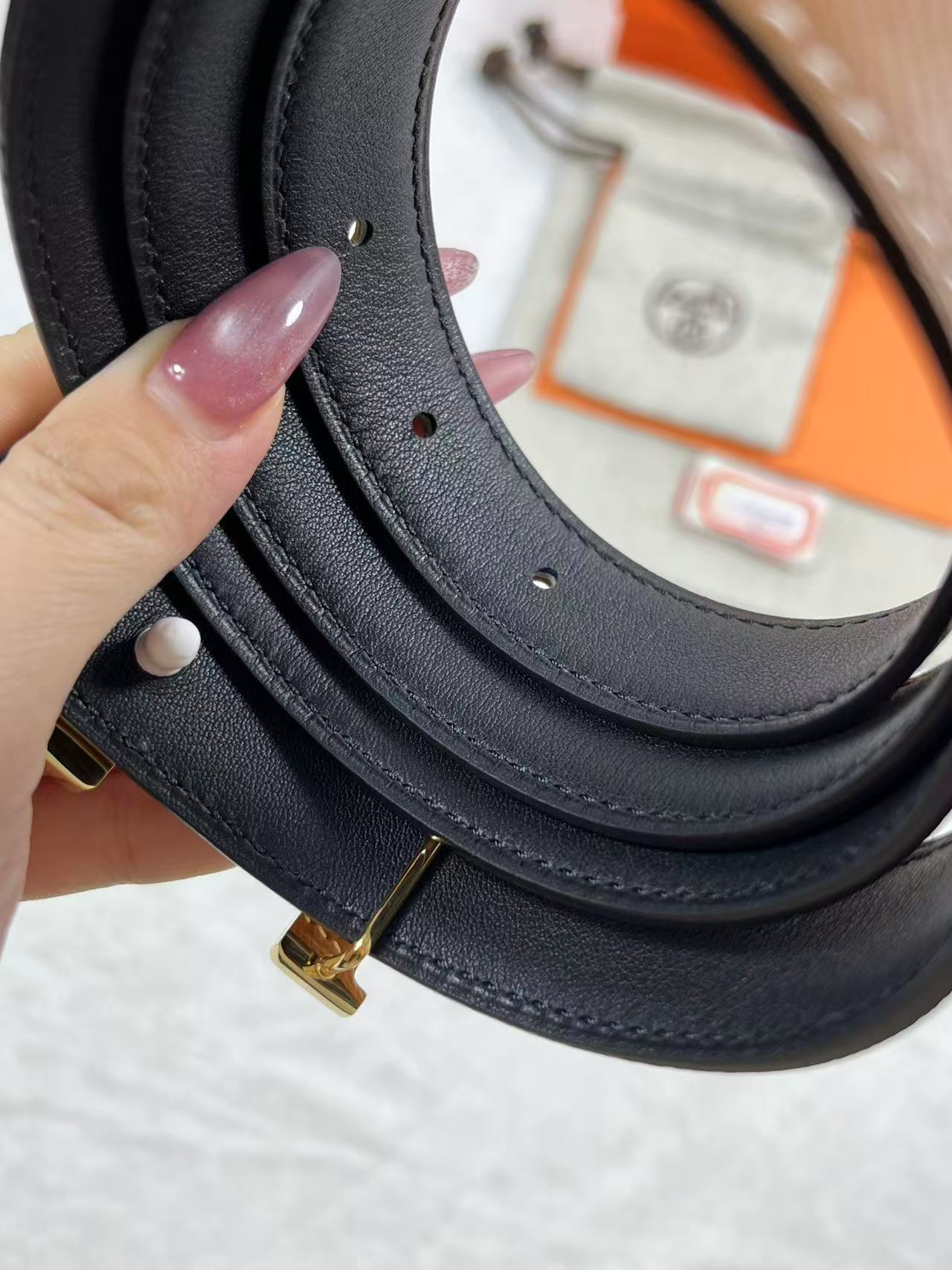 Hermès Focus H buckle and reversible leather strap belt 2.4mm in black and tawny brown leather with a rose gold-plated