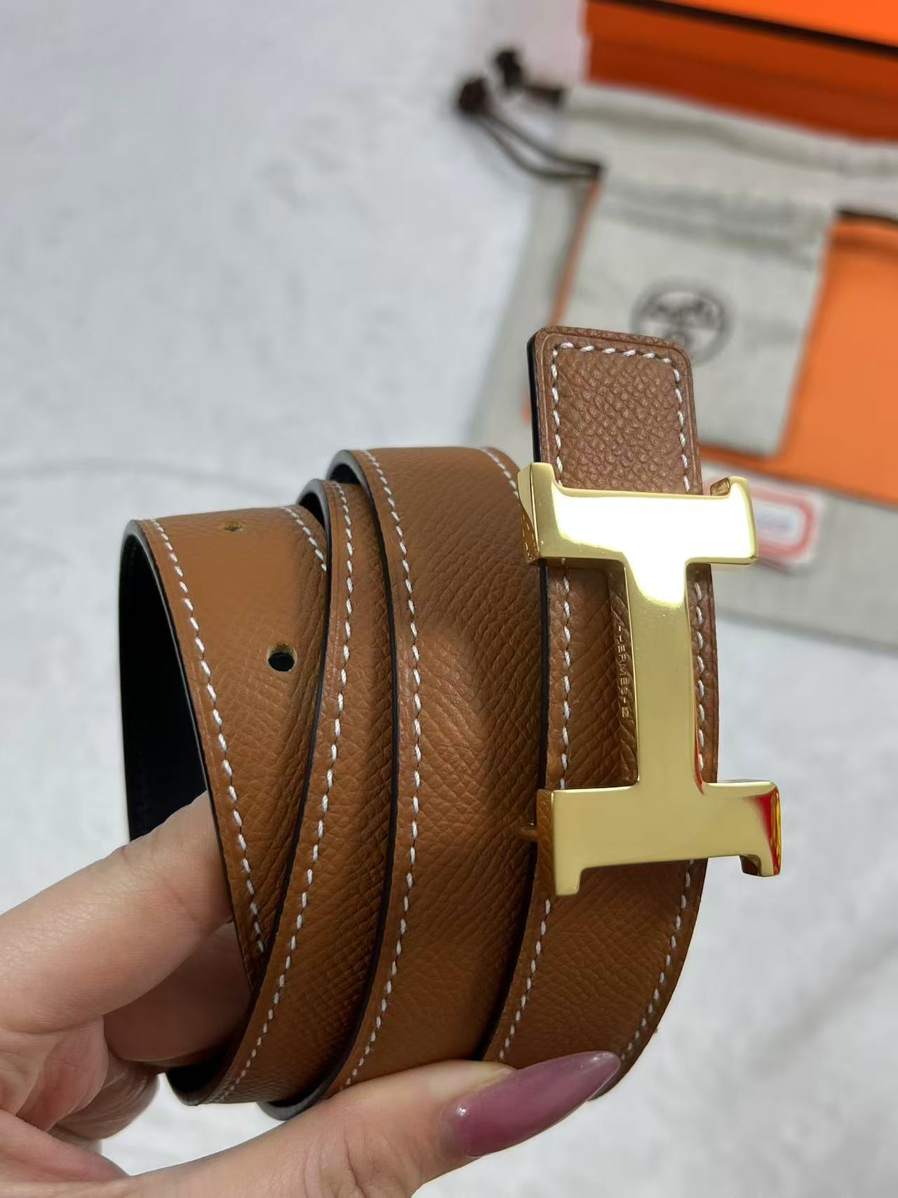 Hermès Focus H buckle and reversible leather strap belt 2.4mm in black and tawny brown leather with a rose gold-plated