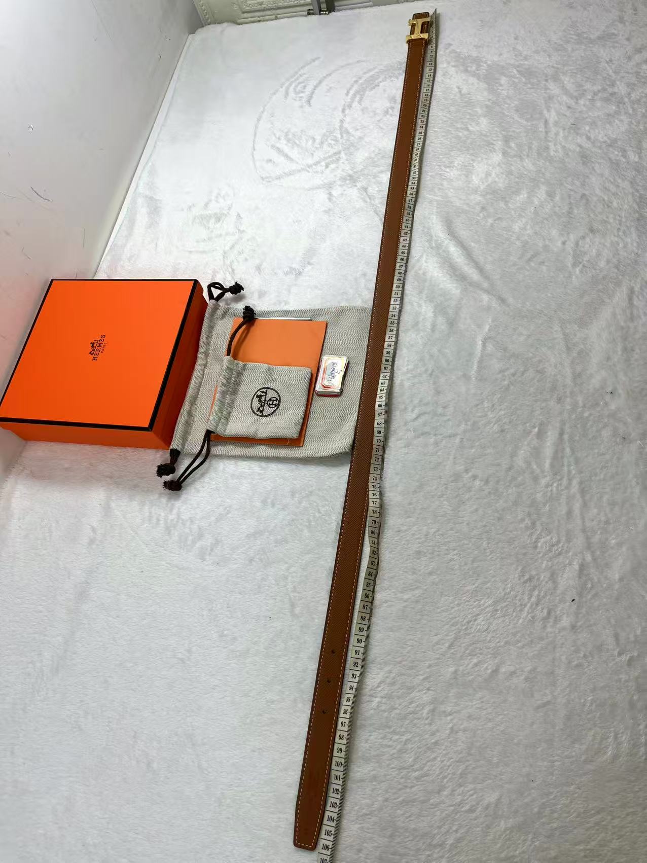 Hermès Focus H buckle and reversible leather strap belt 2.4mm in black and tawny brown leather with a rose gold-plated