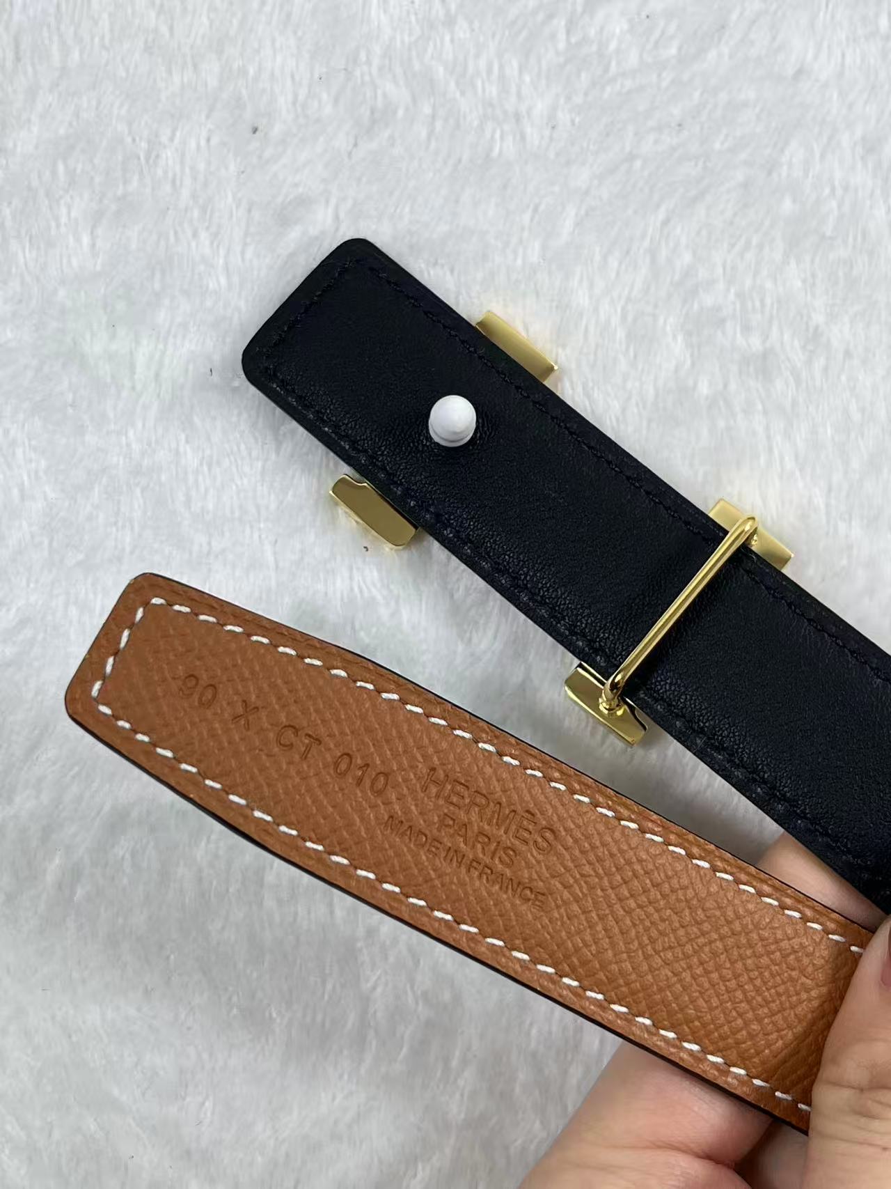 Hermès Focus H buckle and reversible leather strap belt 2.4mm in black and tawny brown leather with a rose gold-plated