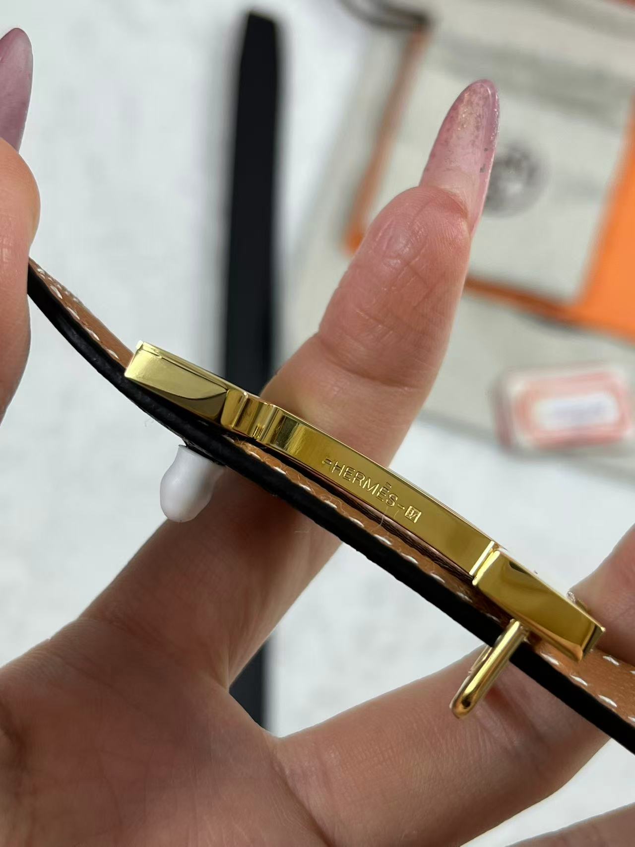 Hermès Focus H buckle and reversible leather strap belt 2.4mm in black and tawny brown leather with a rose gold-plated