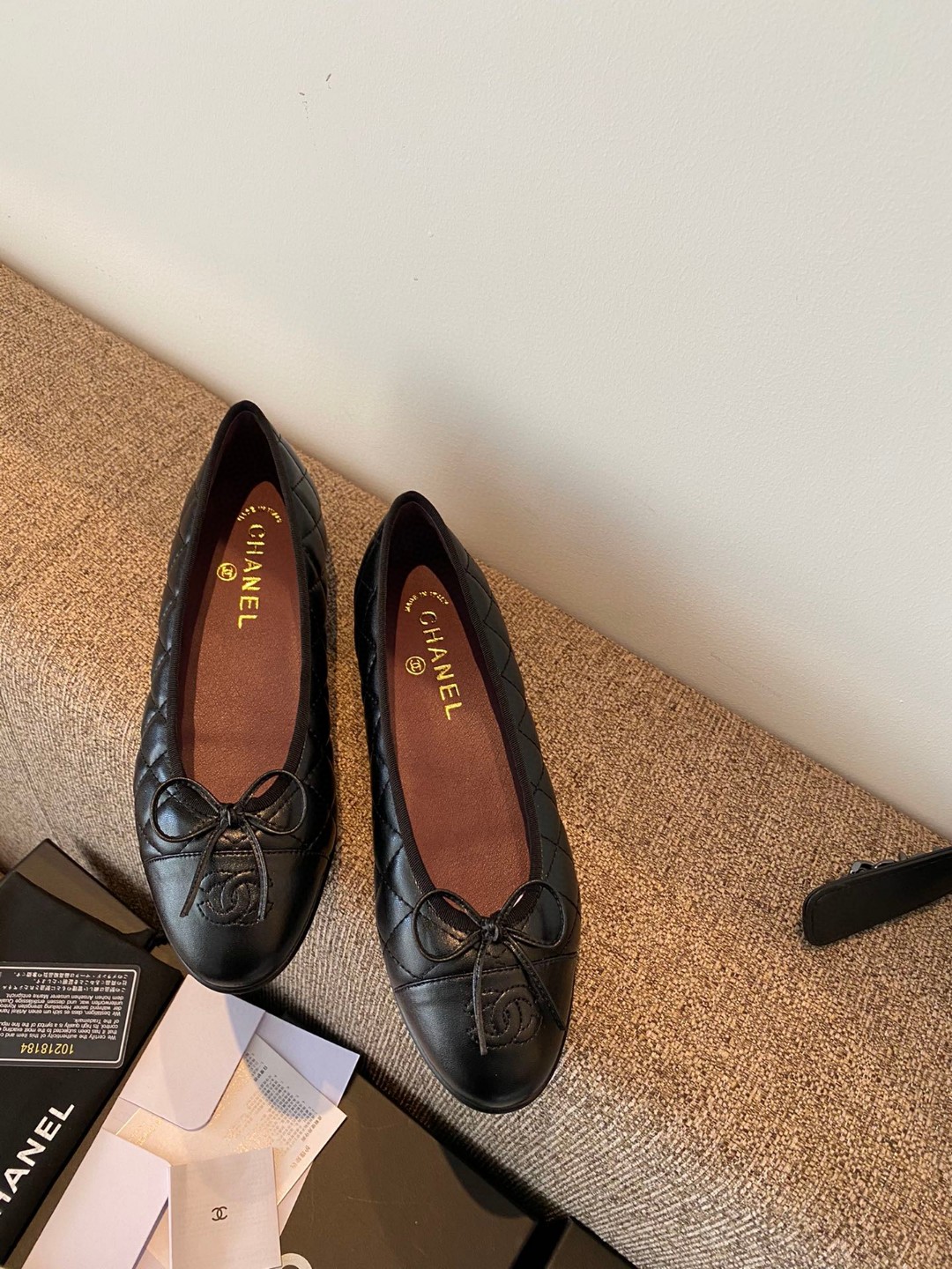 Chanel quilted aged calfskin ballet flats in black