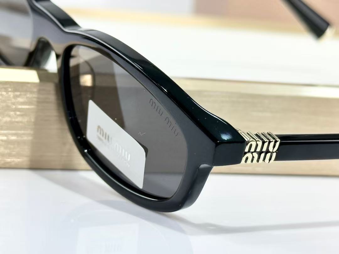 Miu Miu Sunglasses in black with grey