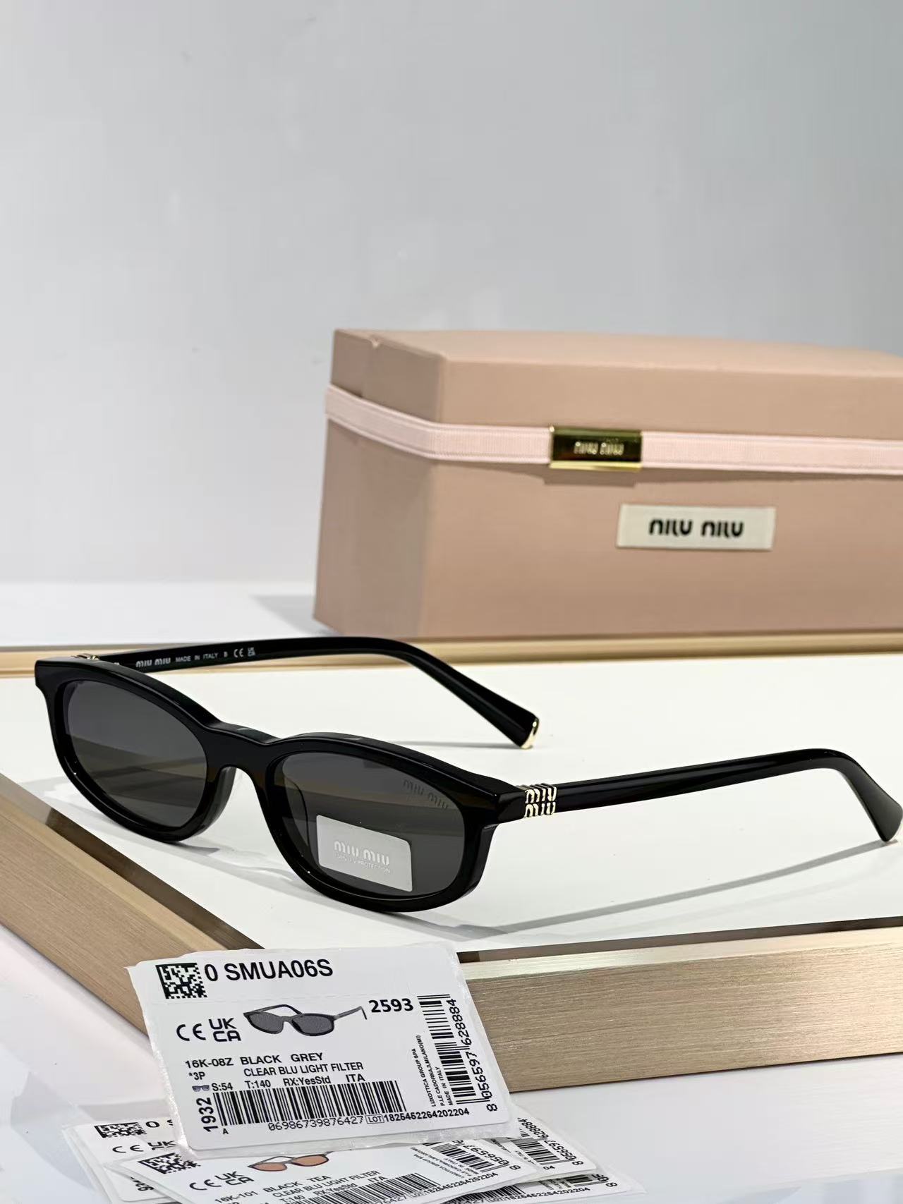 Miu Miu Sunglasses in black with grey