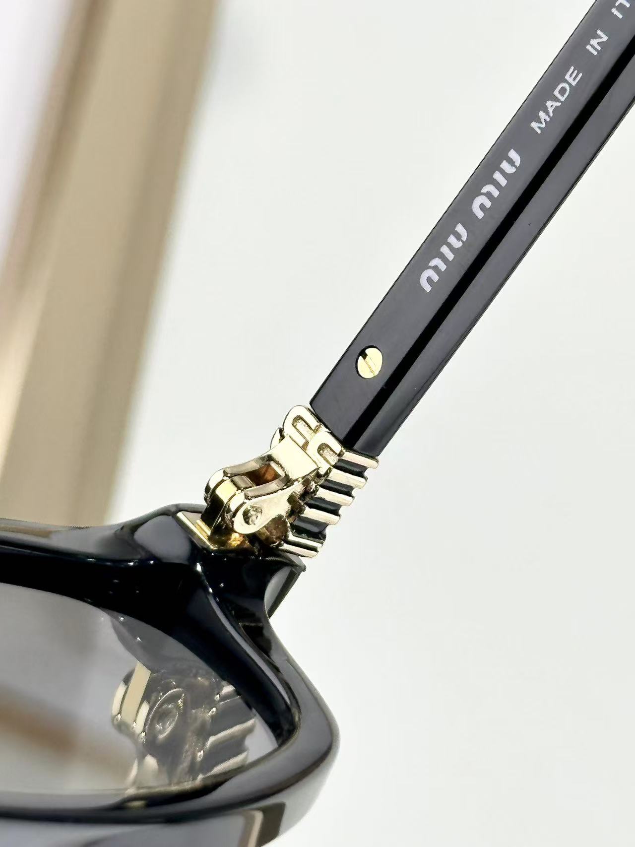 Miu Miu Sunglasses in black with grey