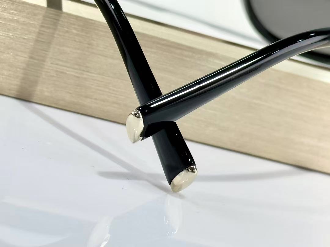 Miu Miu Sunglasses in black with grey