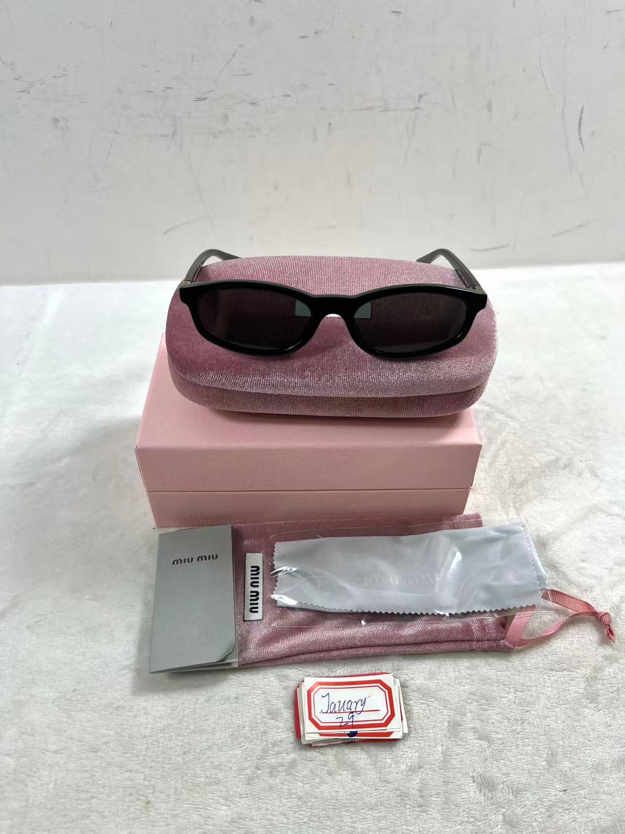 Miu Miu MU A06S black acetate oval sunglasses