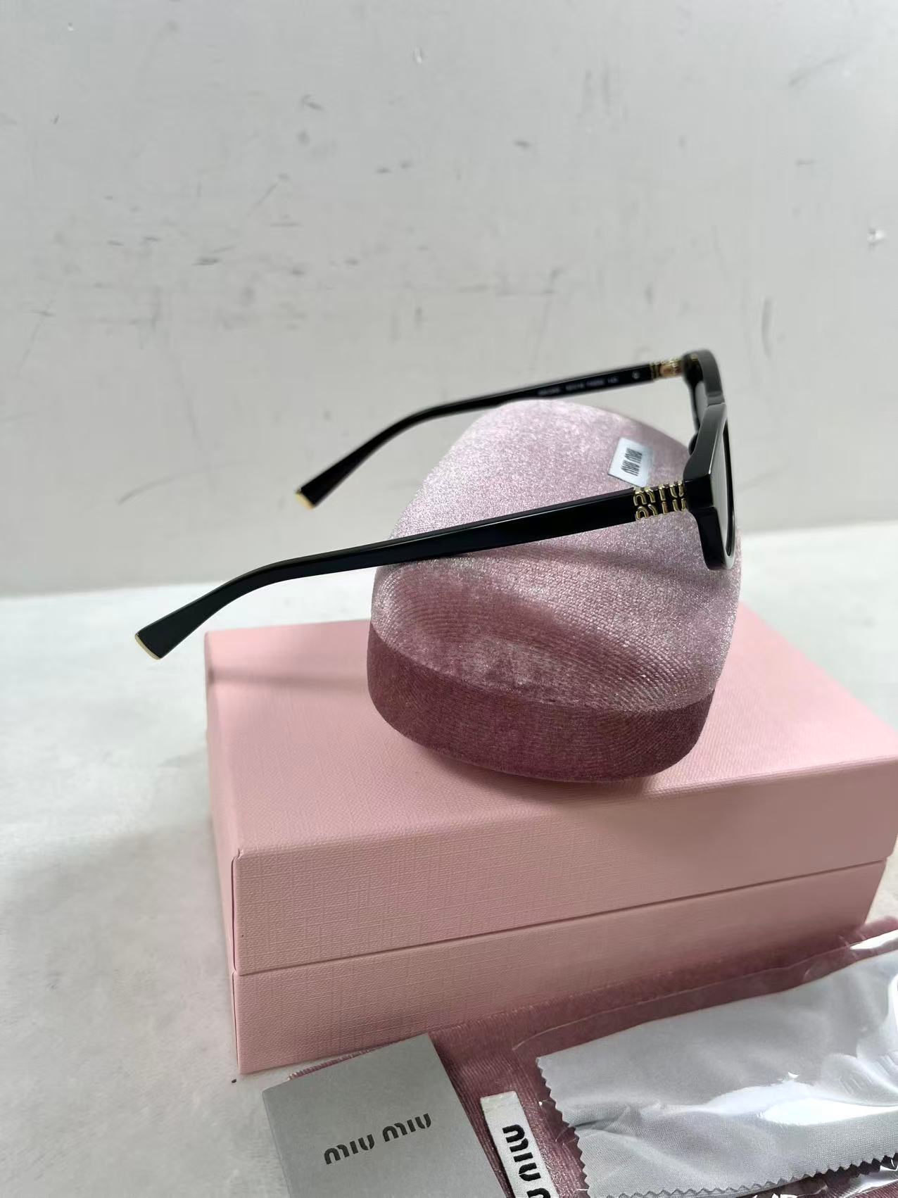 Miu Miu MU A06S black acetate oval sunglasses