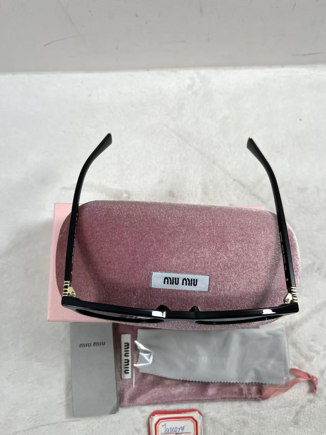 Miu Miu MU A06S black acetate oval sunglasses