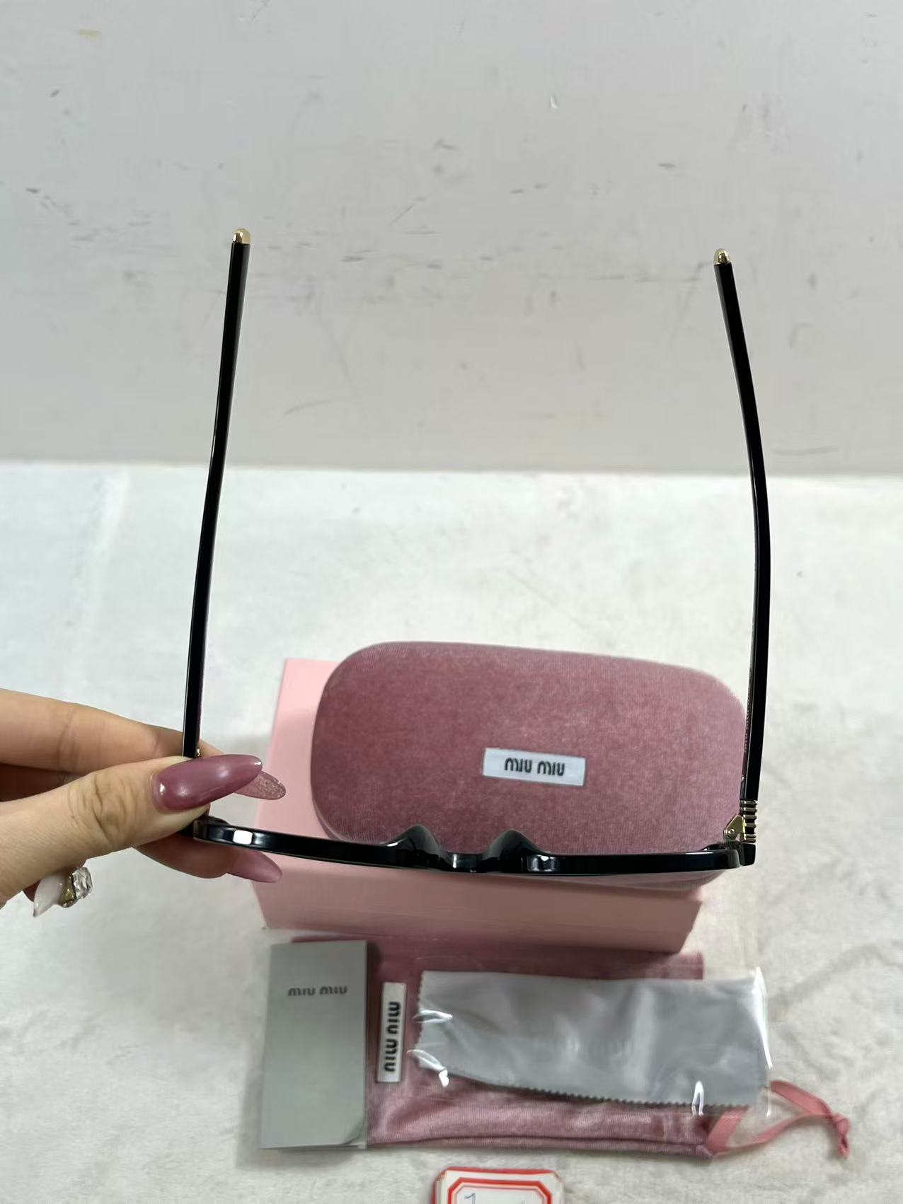 Miu Miu MU A06S black acetate oval sunglasses