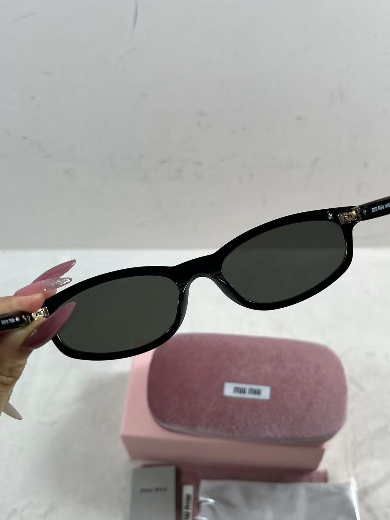 Miu Miu MU A06S black acetate oval sunglasses