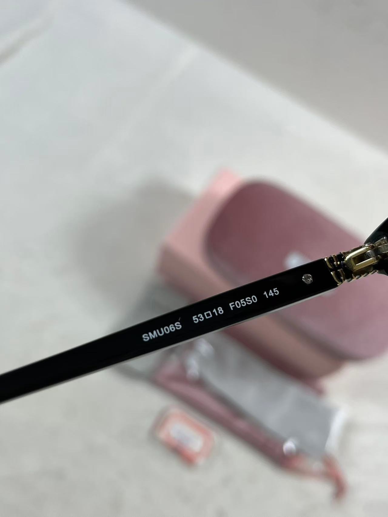 Miu Miu MU A06S black acetate oval sunglasses