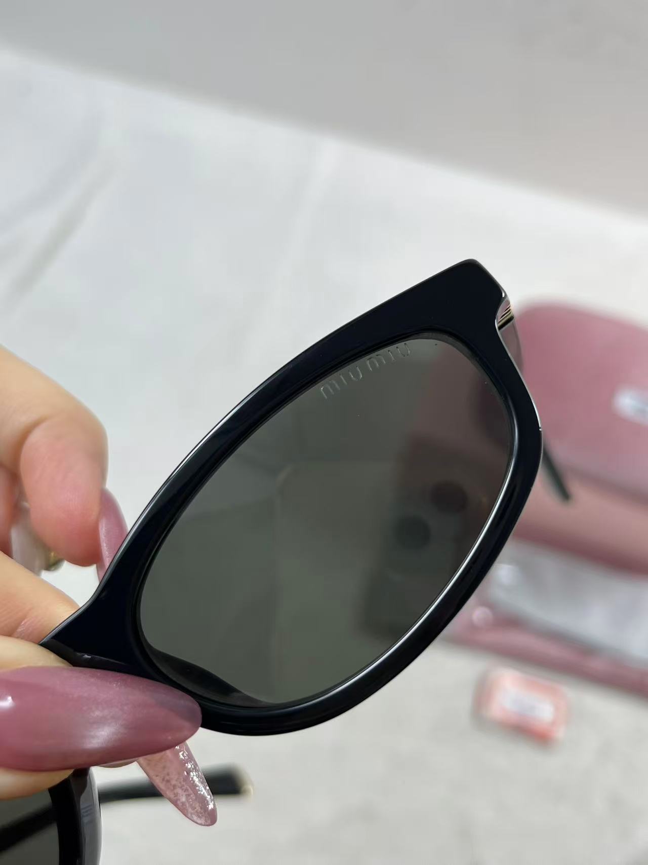 Miu Miu MU A06S black acetate oval sunglasses