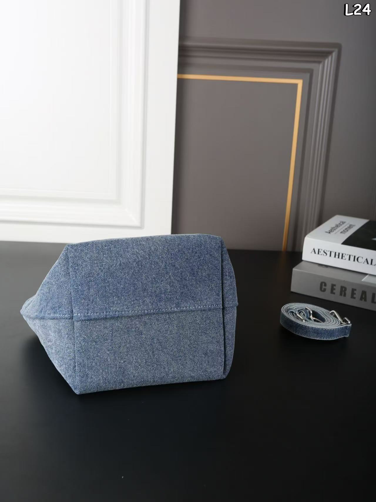 Alexander Wang Medium Punch denim tote bag in a vintage medium indigo wash