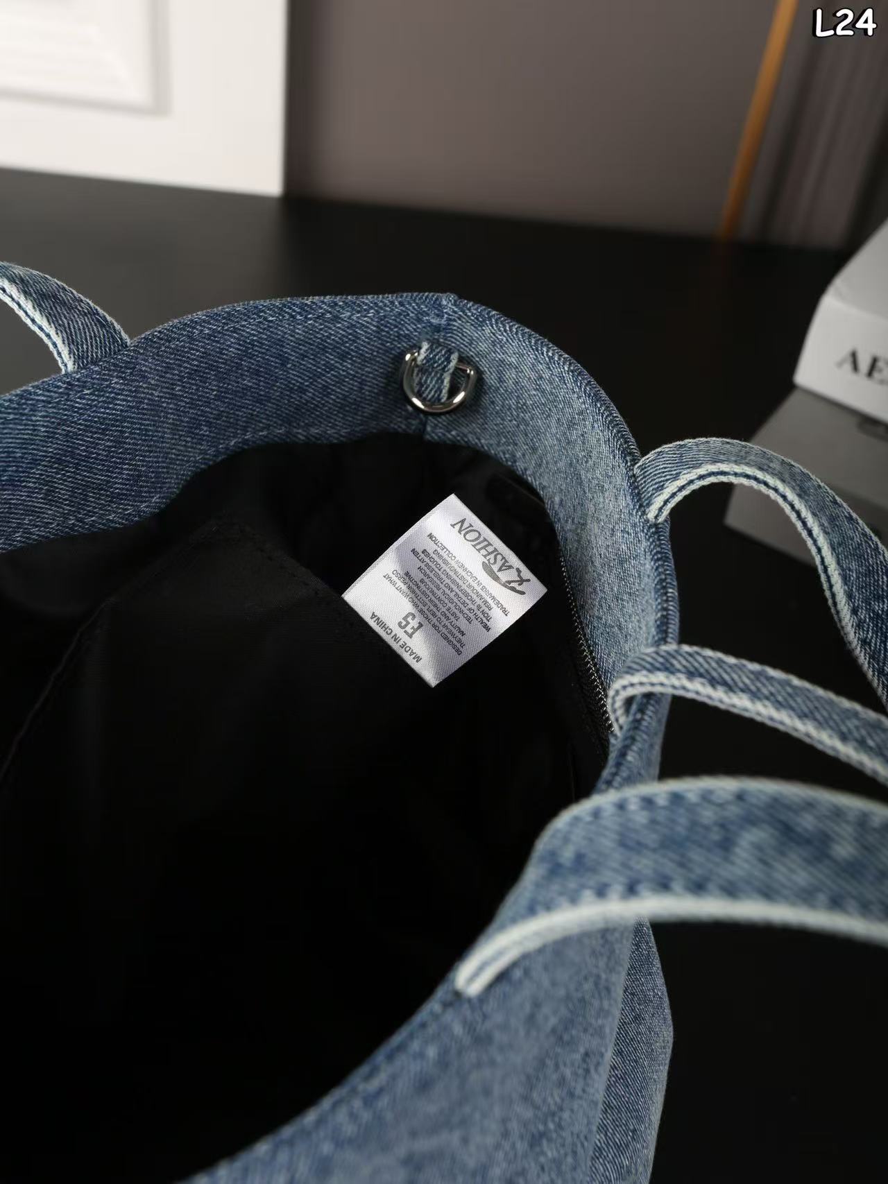 Alexander Wang Medium Punch denim tote bag in a vintage medium indigo wash