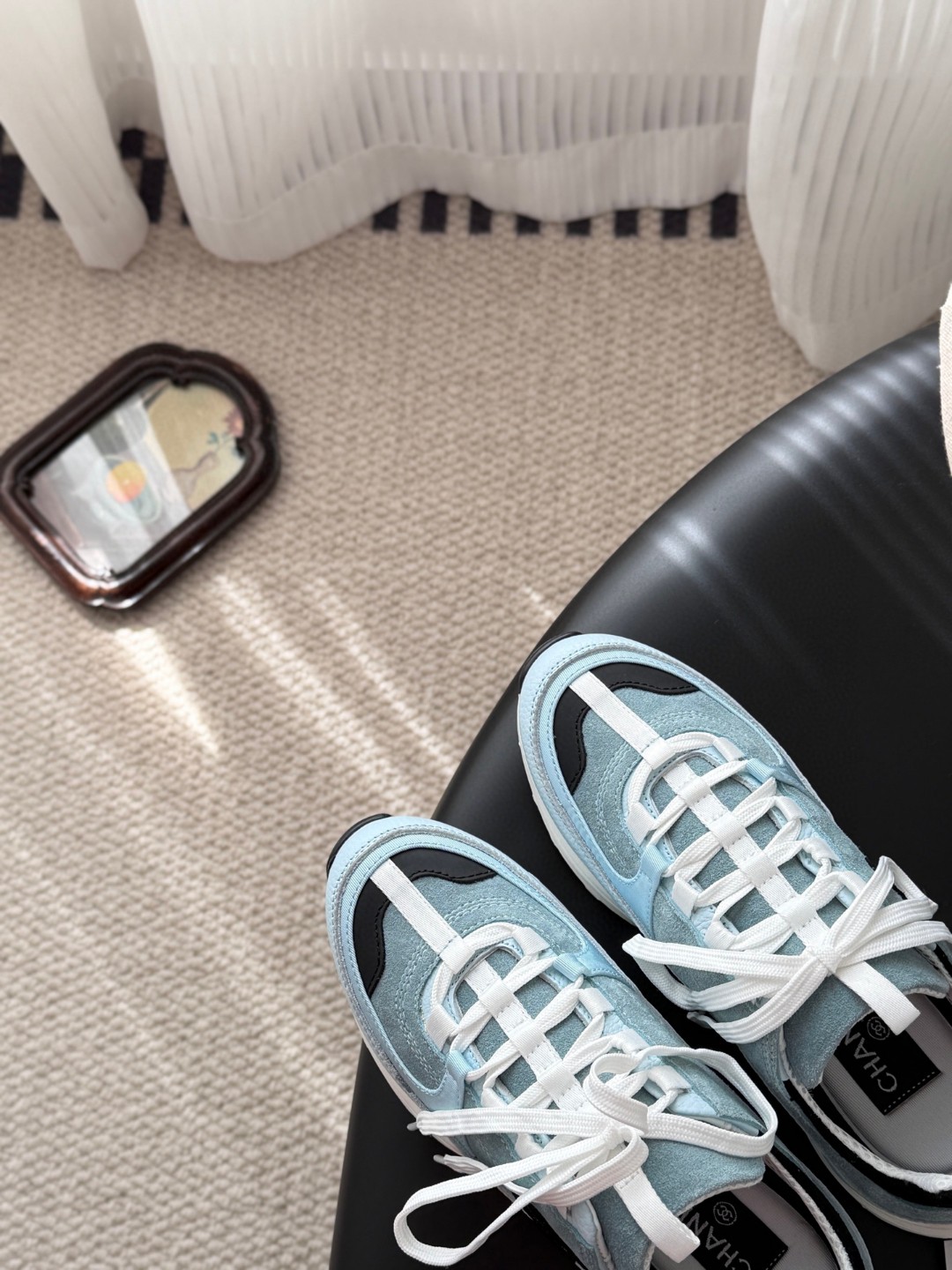 Chanel light blue and black Chanel suede calfskin grosgrain CC sneakers distinctive black CC logo on the side.