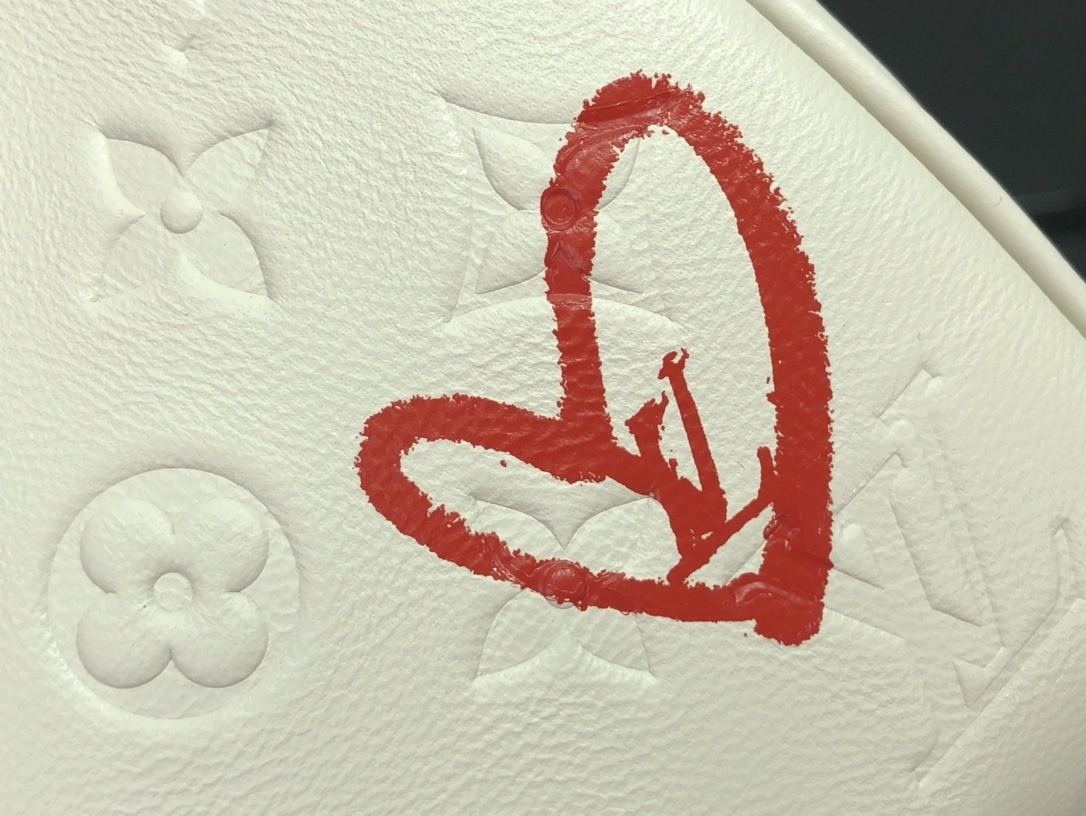 LV Speedy Bandoulière 22 bag in ivory Monogram-embossed lambskin leather, part of the "Fall in Love" capsule collection.