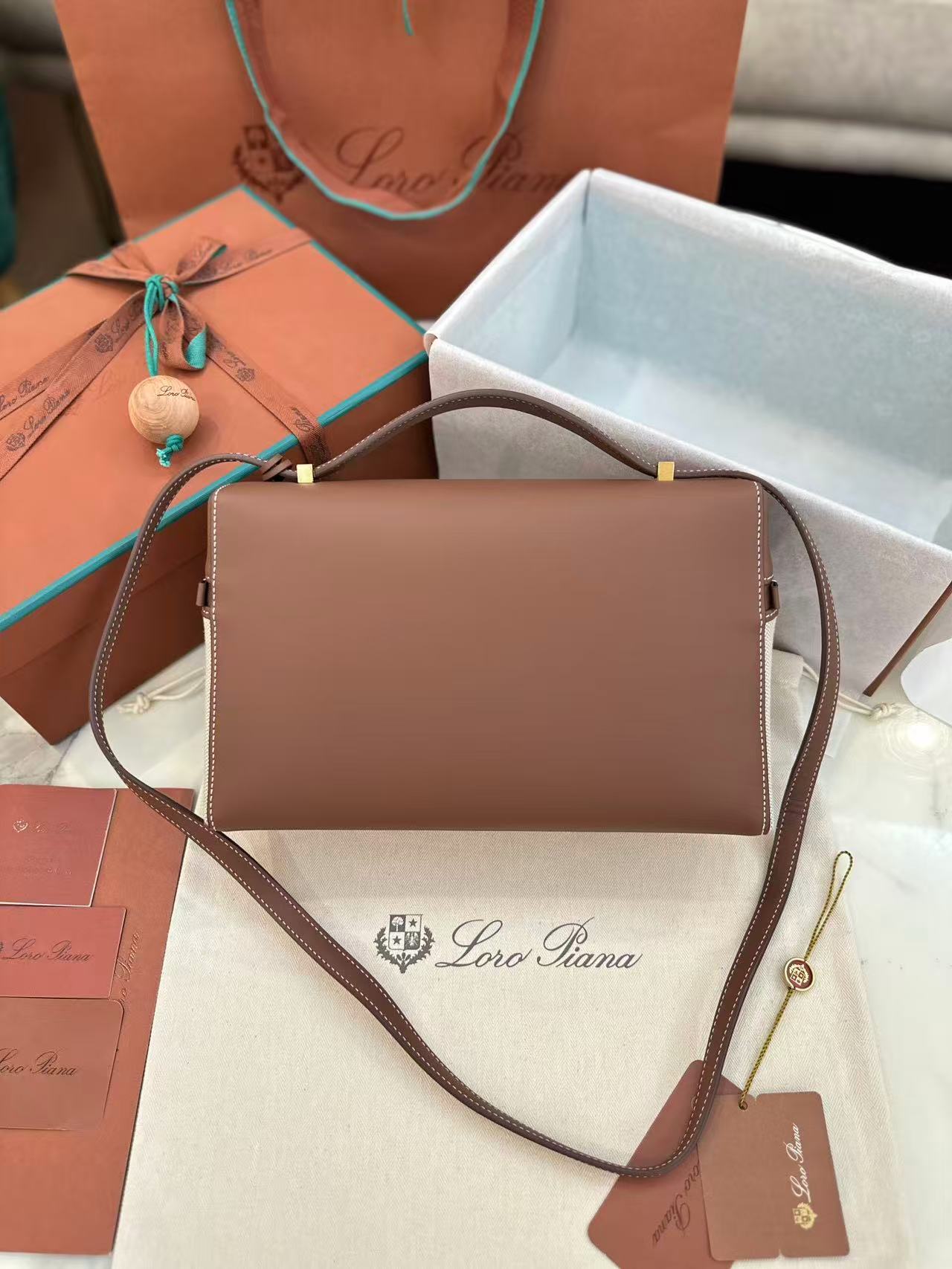 Loro Piana Extra Bag L27 in a natural/caramel sugar colorway cotton and linen blend with leather trim