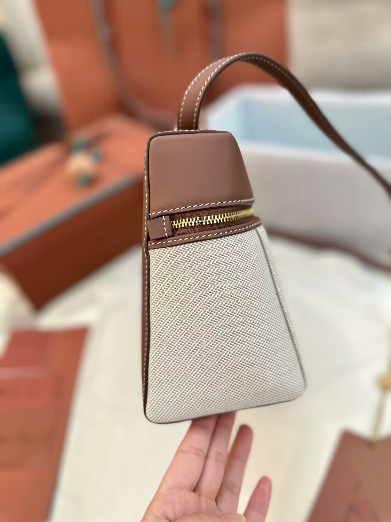 Loro Piana Extra Bag L27 in a natural/caramel sugar colorway cotton and linen blend with leather trim