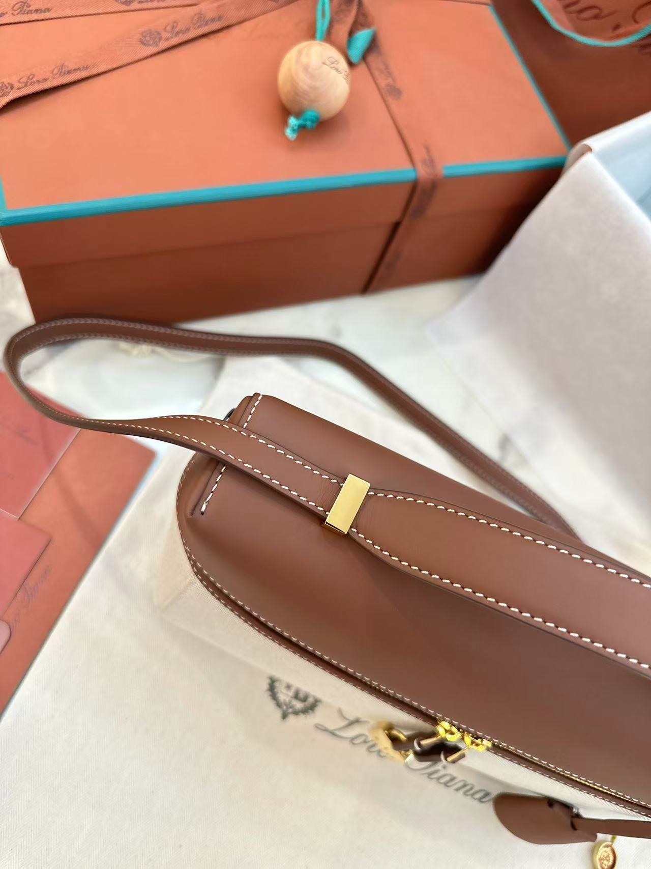 Loro Piana Extra Bag L27 in a natural/caramel sugar colorway cotton and linen blend with leather trim