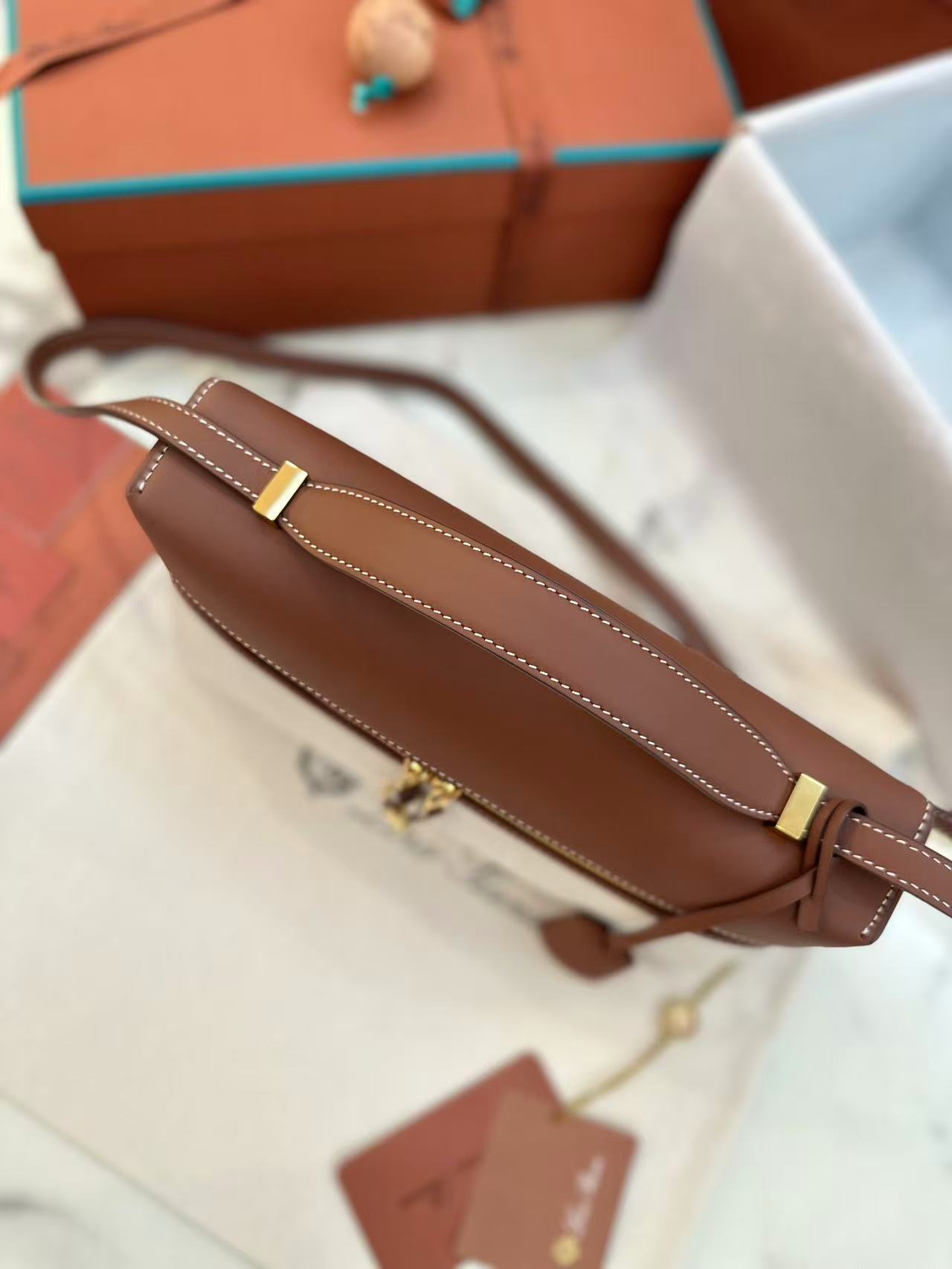 Loro Piana Extra Bag L27 in a natural/caramel sugar colorway cotton and linen blend with leather trim