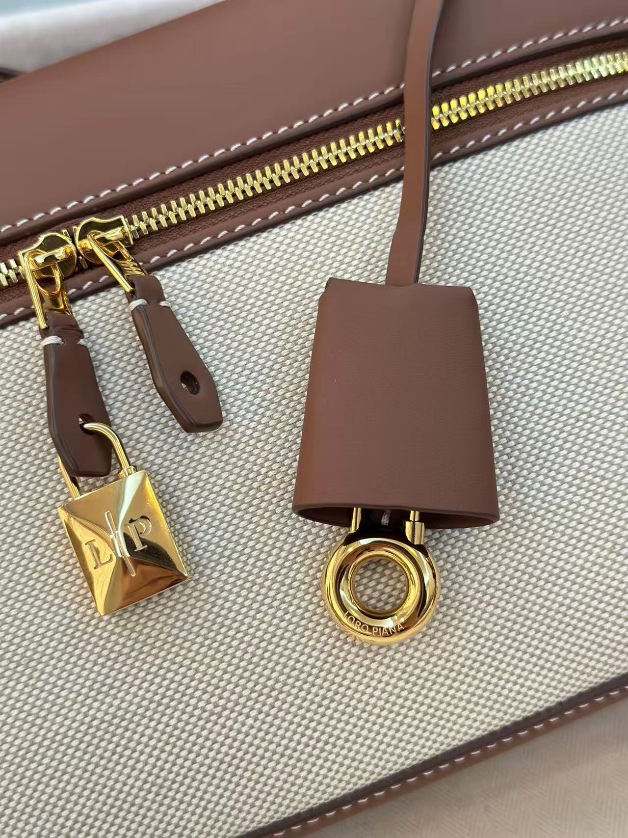 Loro Piana Extra Bag L27 in a natural/caramel sugar colorway cotton and linen blend with leather trim