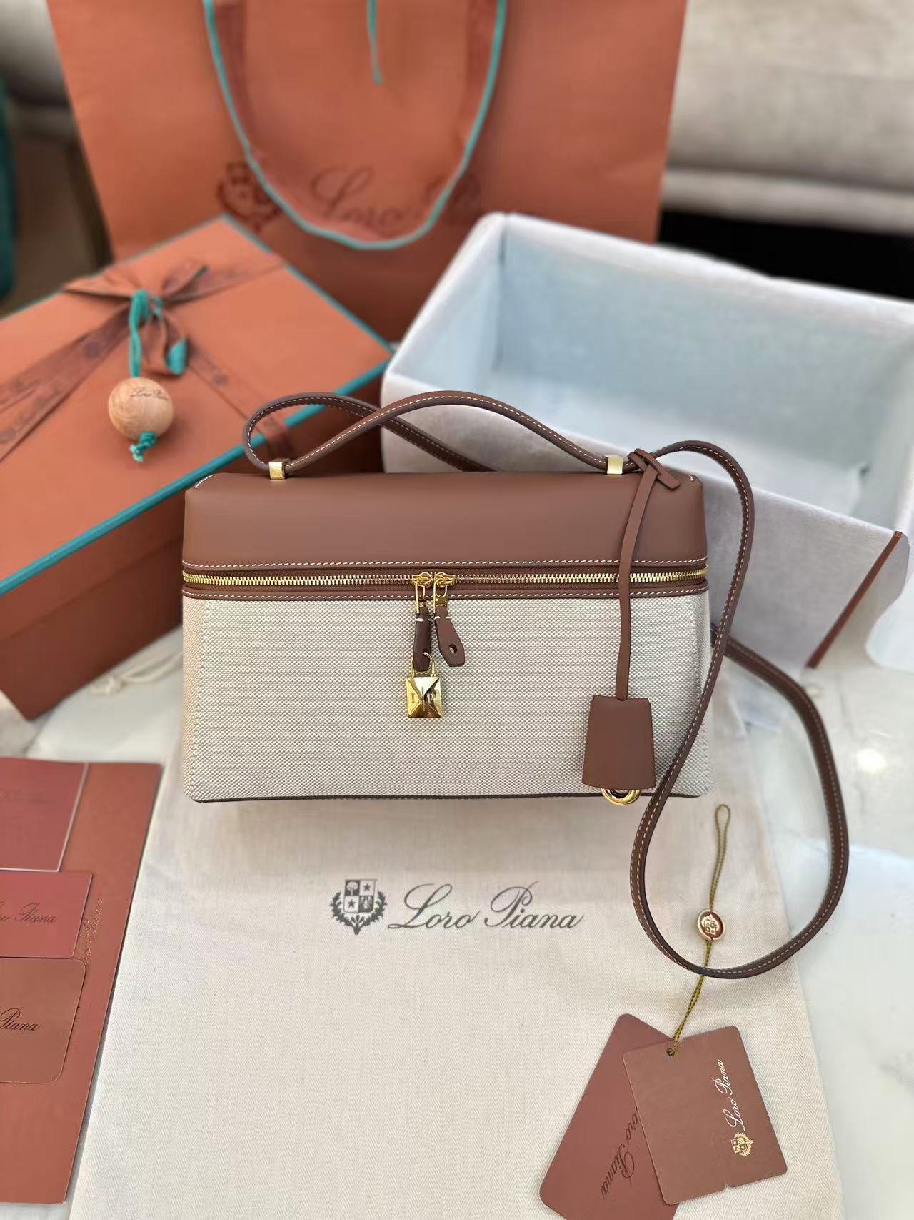 Loro Piana Extra Bag L27 in a natural/caramel sugar colorway cotton and linen blend with leather trim