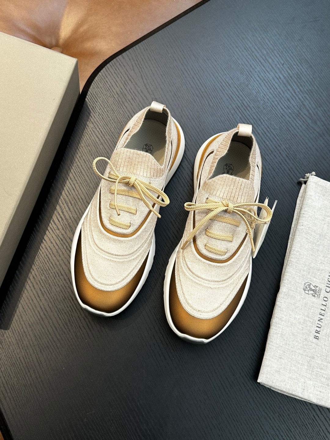 Brunello Cucinelli women's sneakers with a knitted construction and a rubber outsole