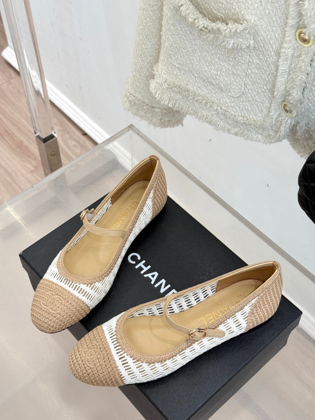 Chanel raffia crochet woven two-tone cap toe ballerina ballet flats in beige and white.