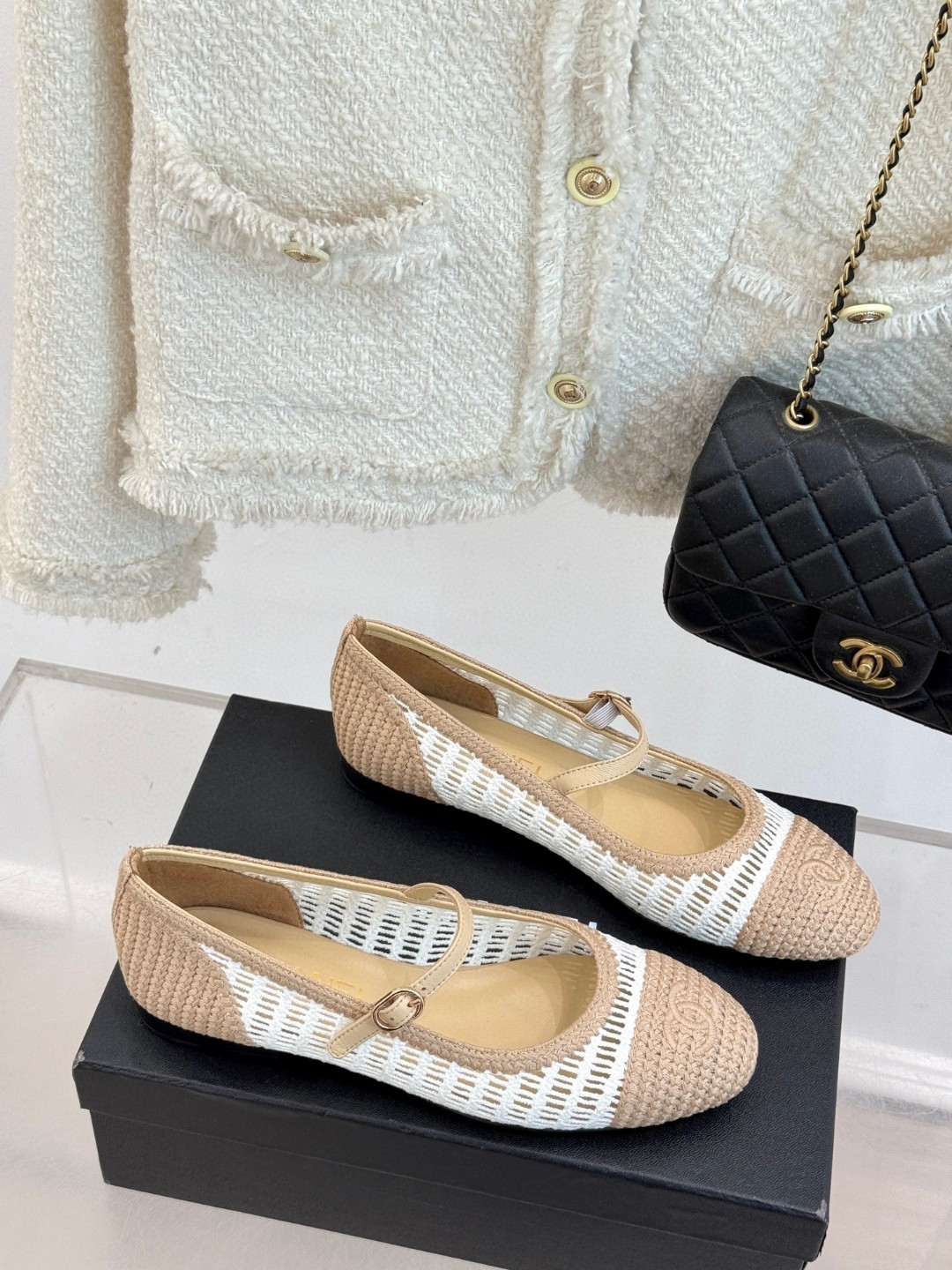 Chanel raffia crochet woven two-tone cap toe ballerina ballet flats in beige and white.