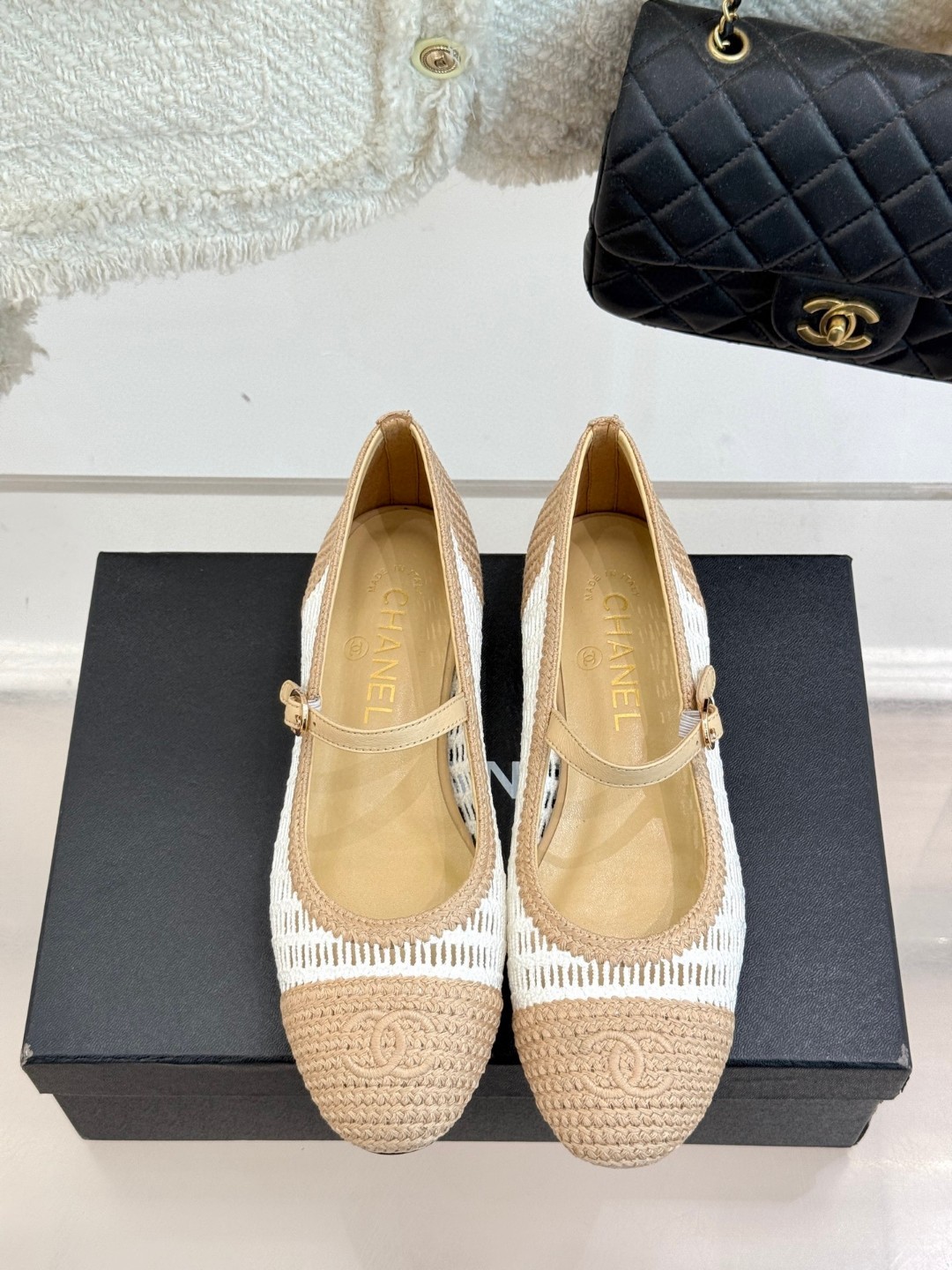 Chanel raffia crochet woven two-tone cap toe ballerina ballet flats in beige and white.