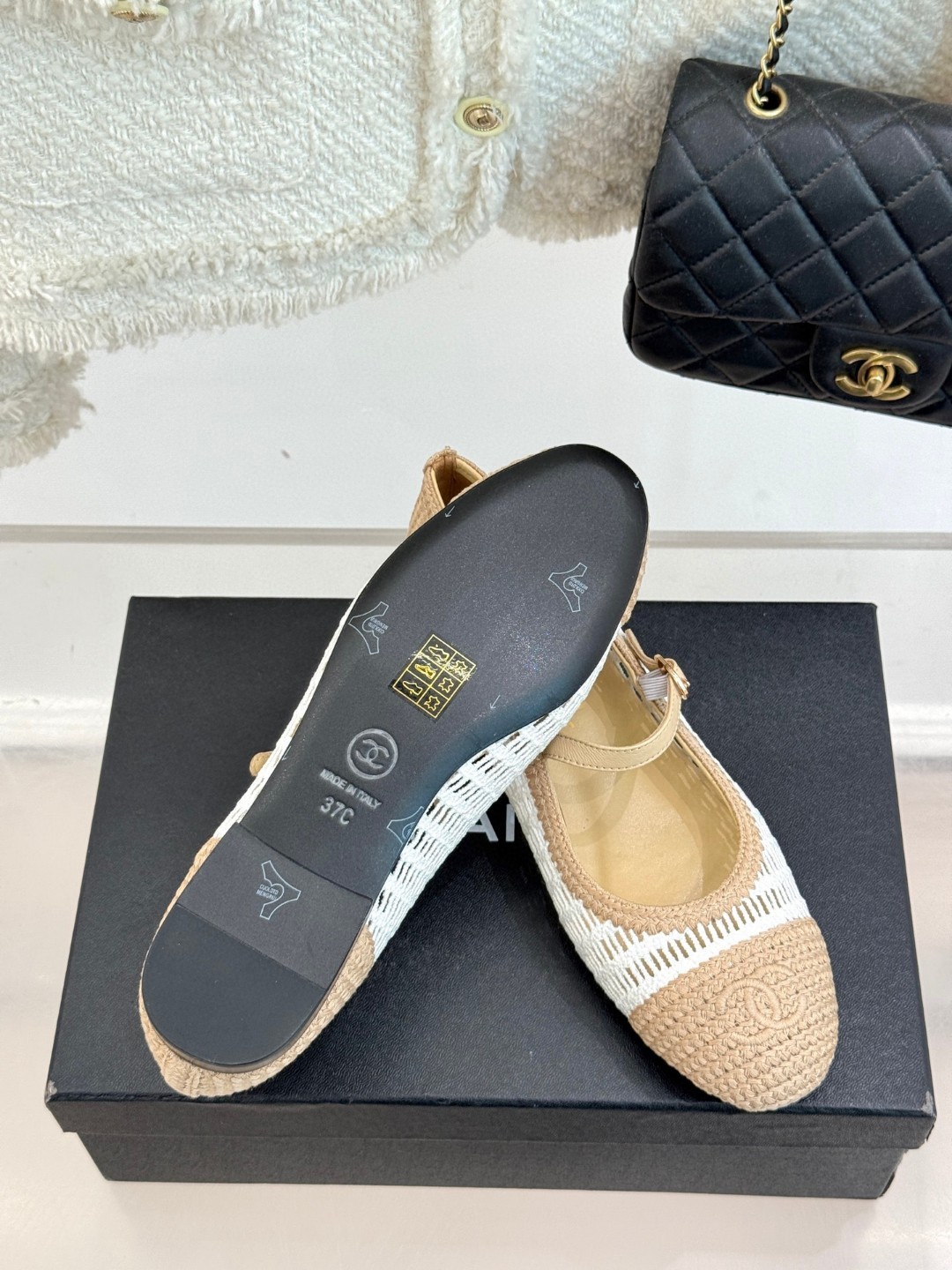 Chanel raffia crochet woven two-tone cap toe ballerina ballet flats in beige and white.