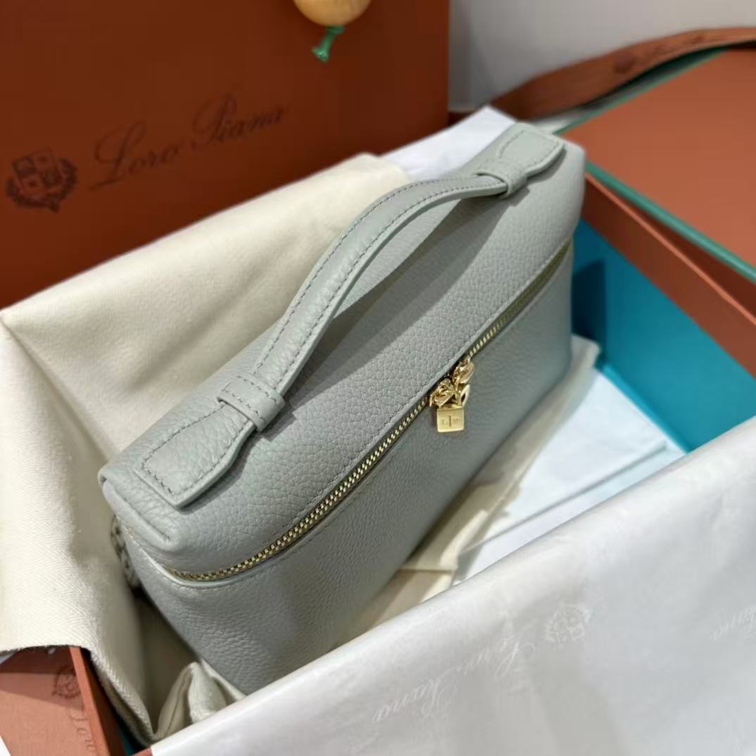 Loro Piana Extra Pocket L19 pouch in light blue is crafted from luxurious leather and features radiant sun gold hardware