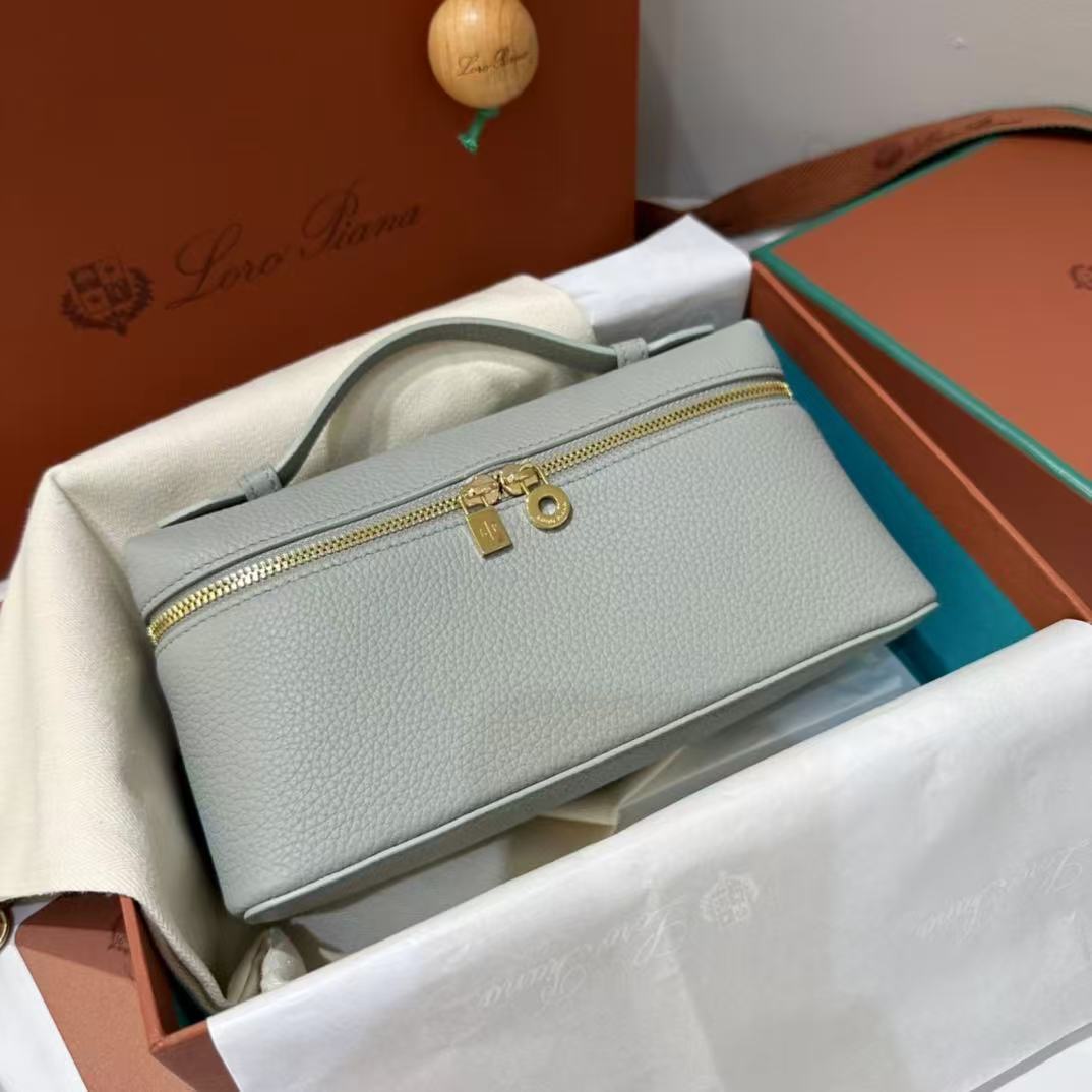 Loro Piana Extra Pocket L19 pouch in light blue is crafted from luxurious leather and features radiant sun gold hardware