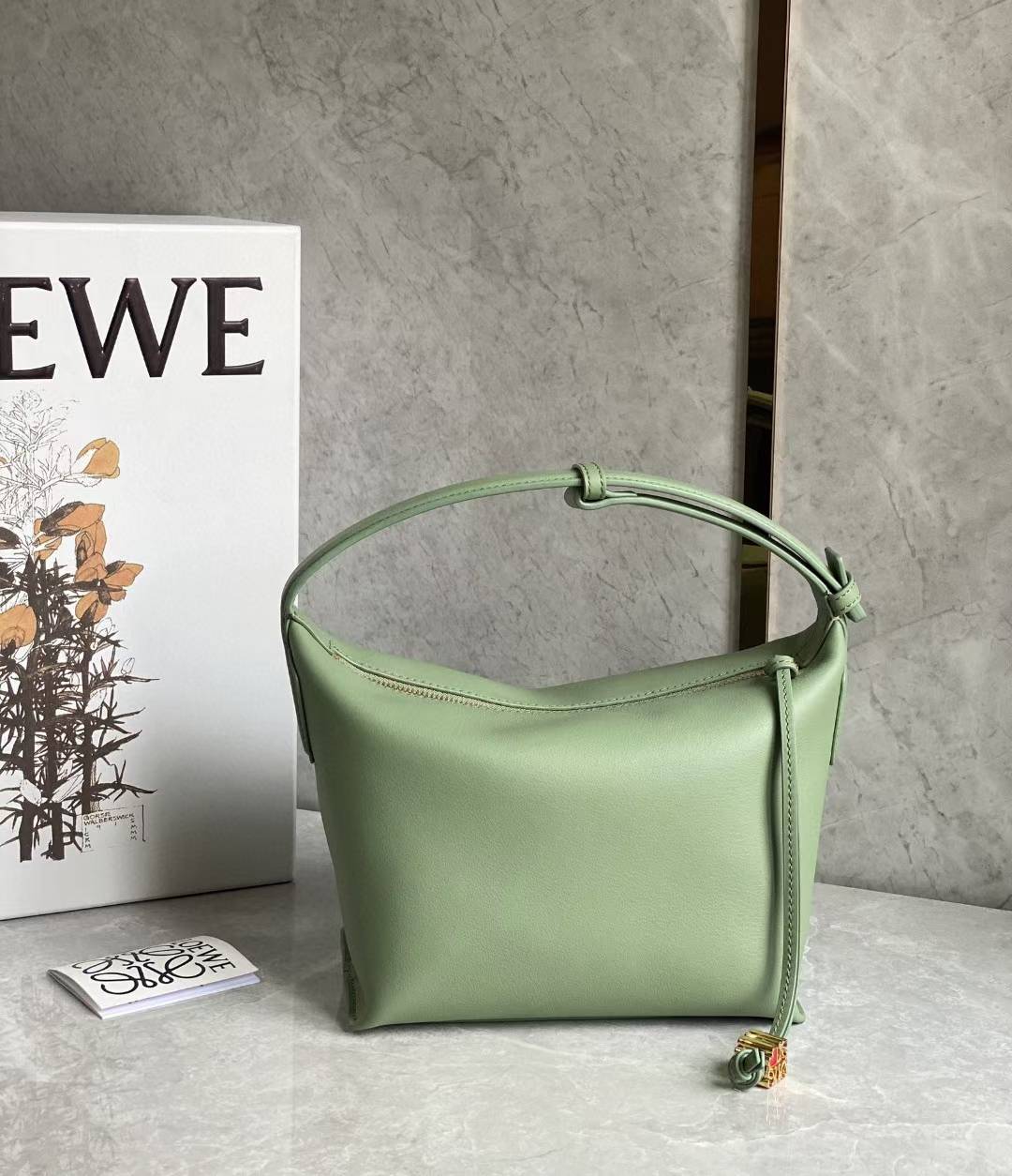 Loewe Small Cubi leather shoulder bag in green.