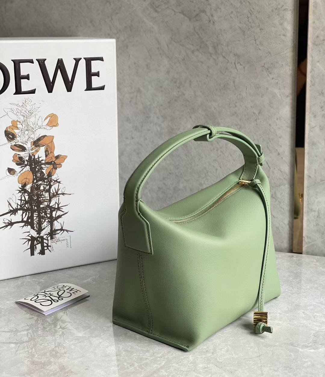 Loewe Small Cubi leather shoulder bag in green.