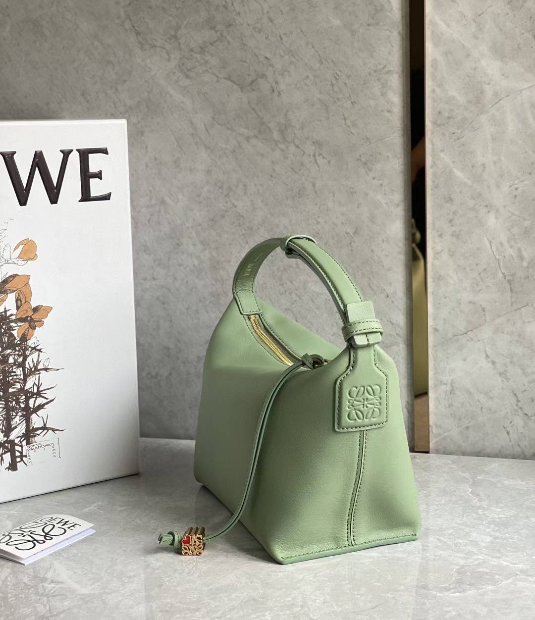 Loewe Small Cubi leather shoulder bag in green.