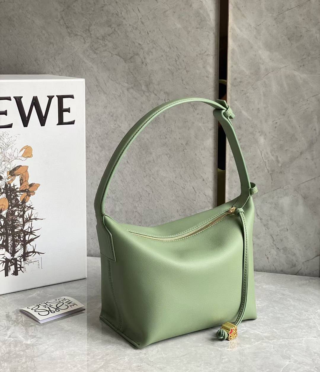 Loewe Small Cubi leather shoulder bag in green.