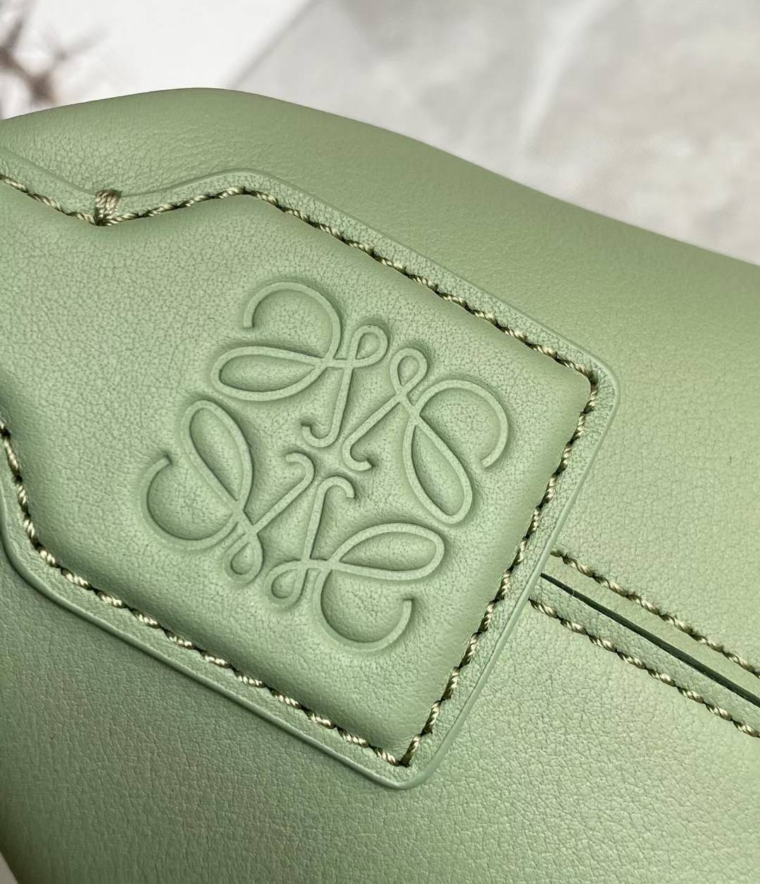 Loewe Small Cubi leather shoulder bag in green.
